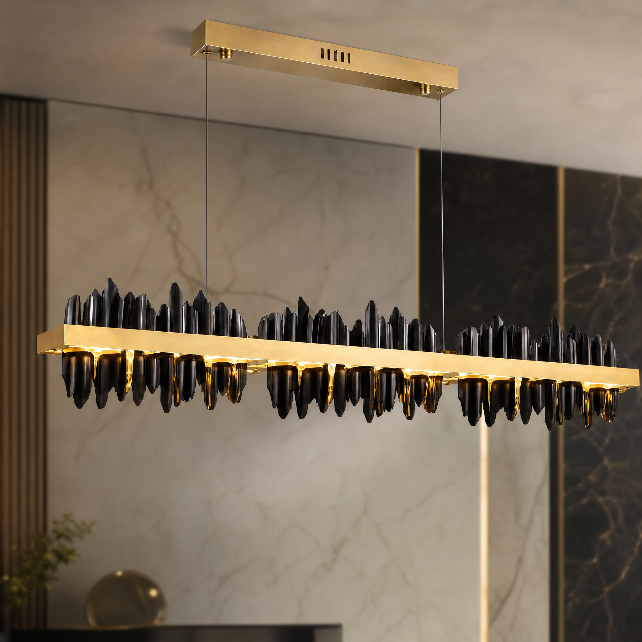 A detailed closeup of the VORELLI Douala Rectangular Chandelier, showcasing the unique shape and high-end, decorative textures that bring a vibrant Cameroon-inspired mood to the space.