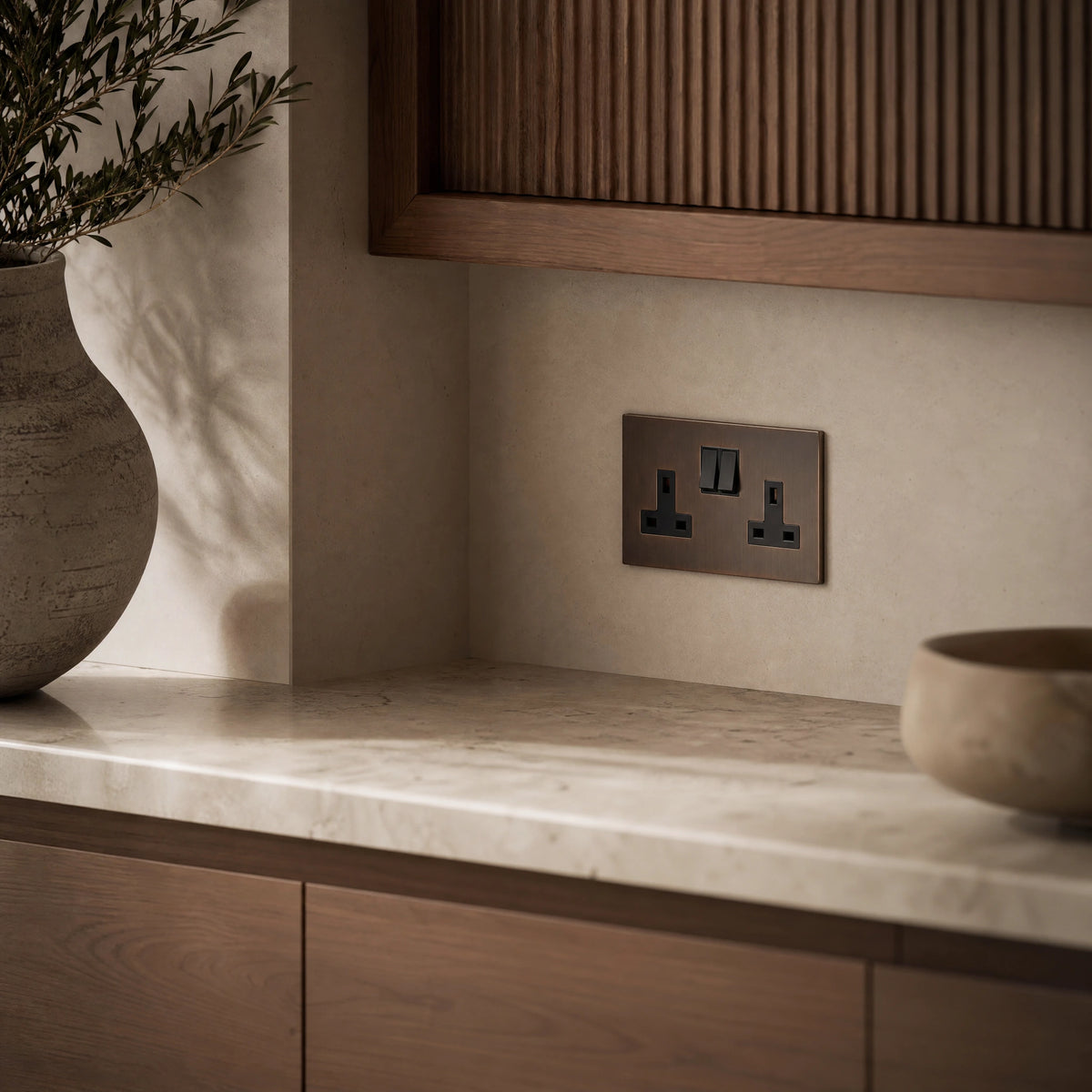 Luxury sienna double socket installed within bespoke walnut cabinetry or stone worktop in a luxury residence in a UHNW interior by VORELLI®.
