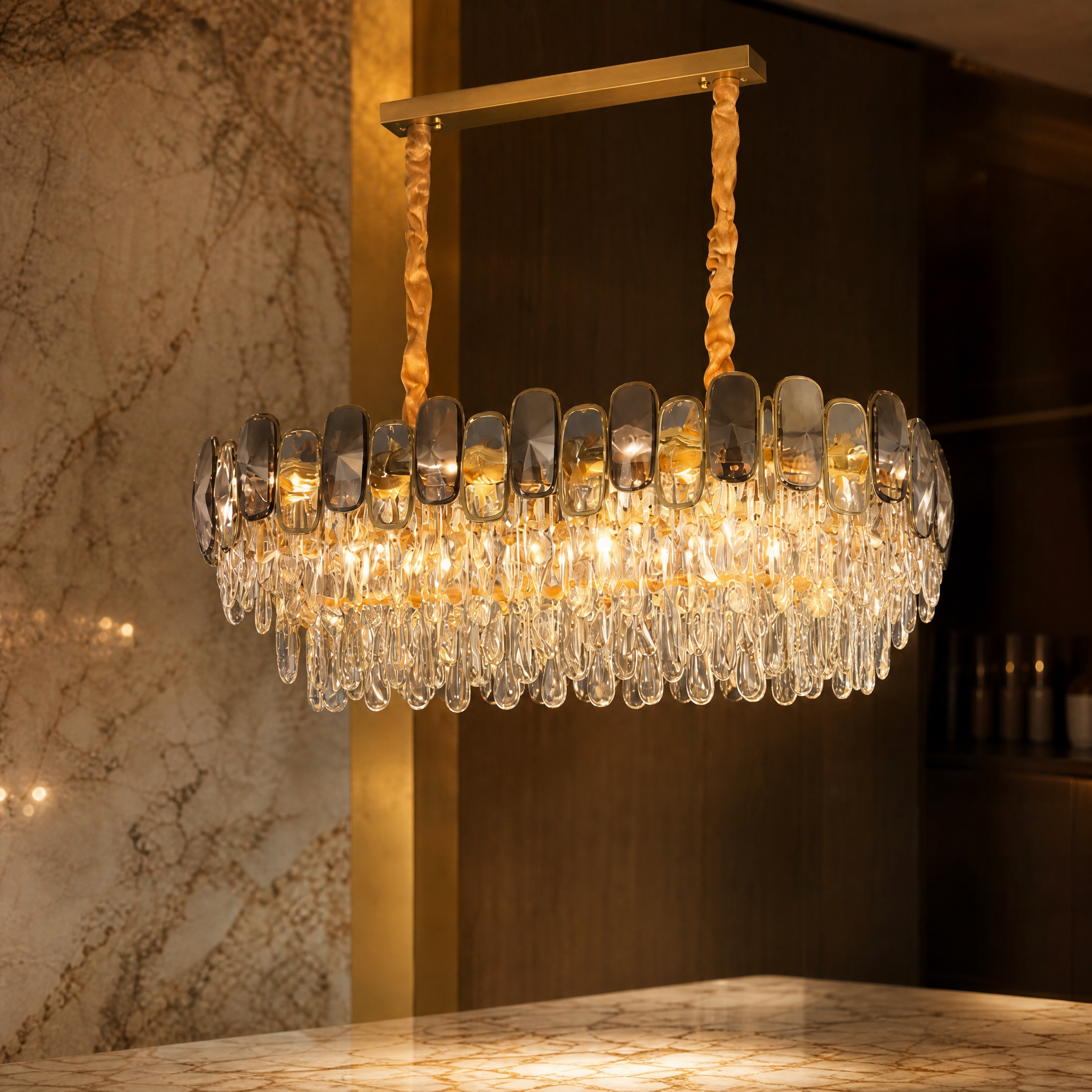 Macro shot focusing on the exquisite oblong and semi-ellipse diamond cut crystals of the Edmond Rectangular Chandelier by Vorelli.