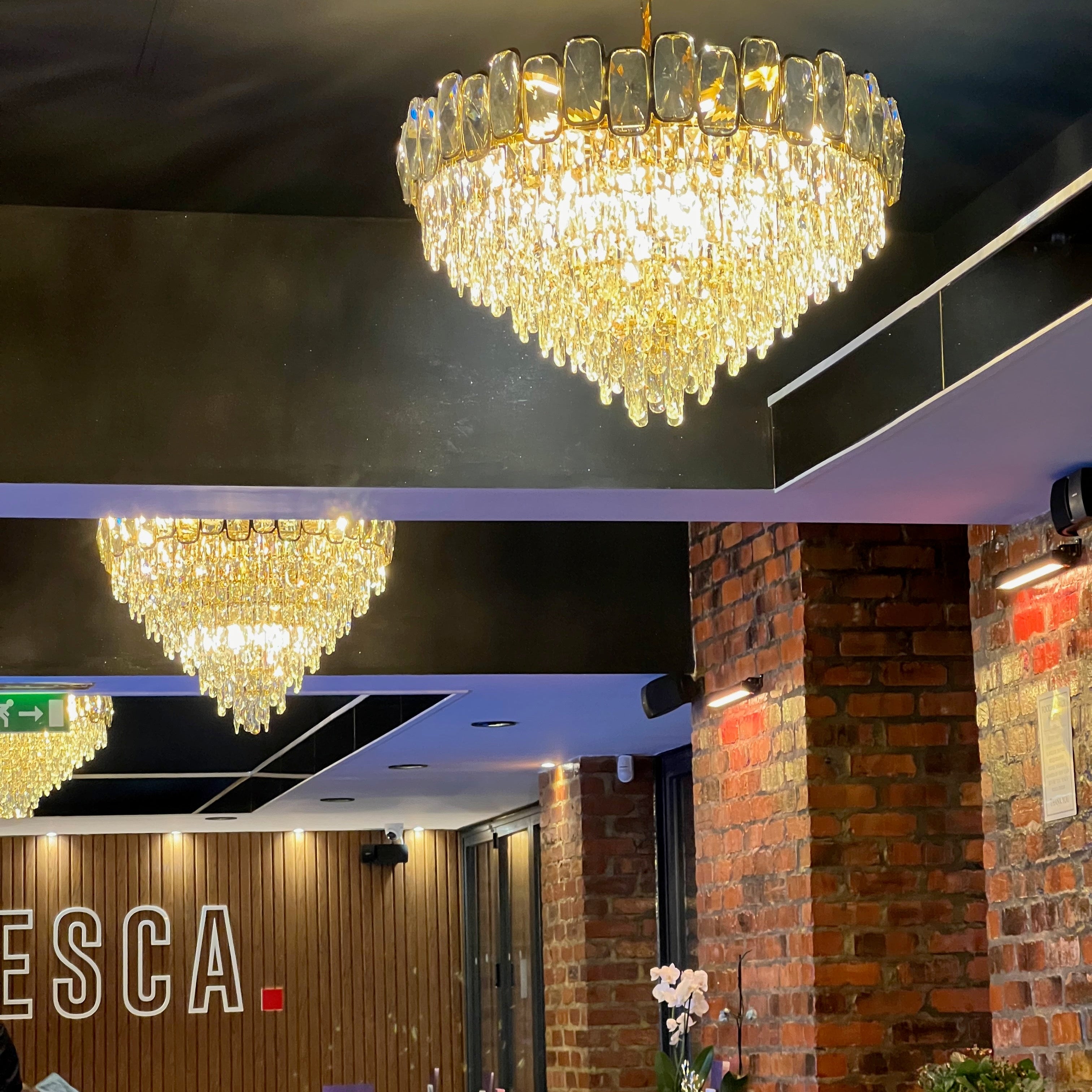 Close view of VORELLI Edmond circular chandelier with layered diamond-cut crystal drops