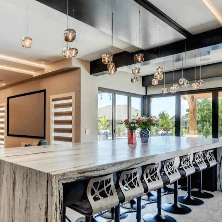 Contemporary linear glass pendant chandelier over kitchen island interior by VORELLI®