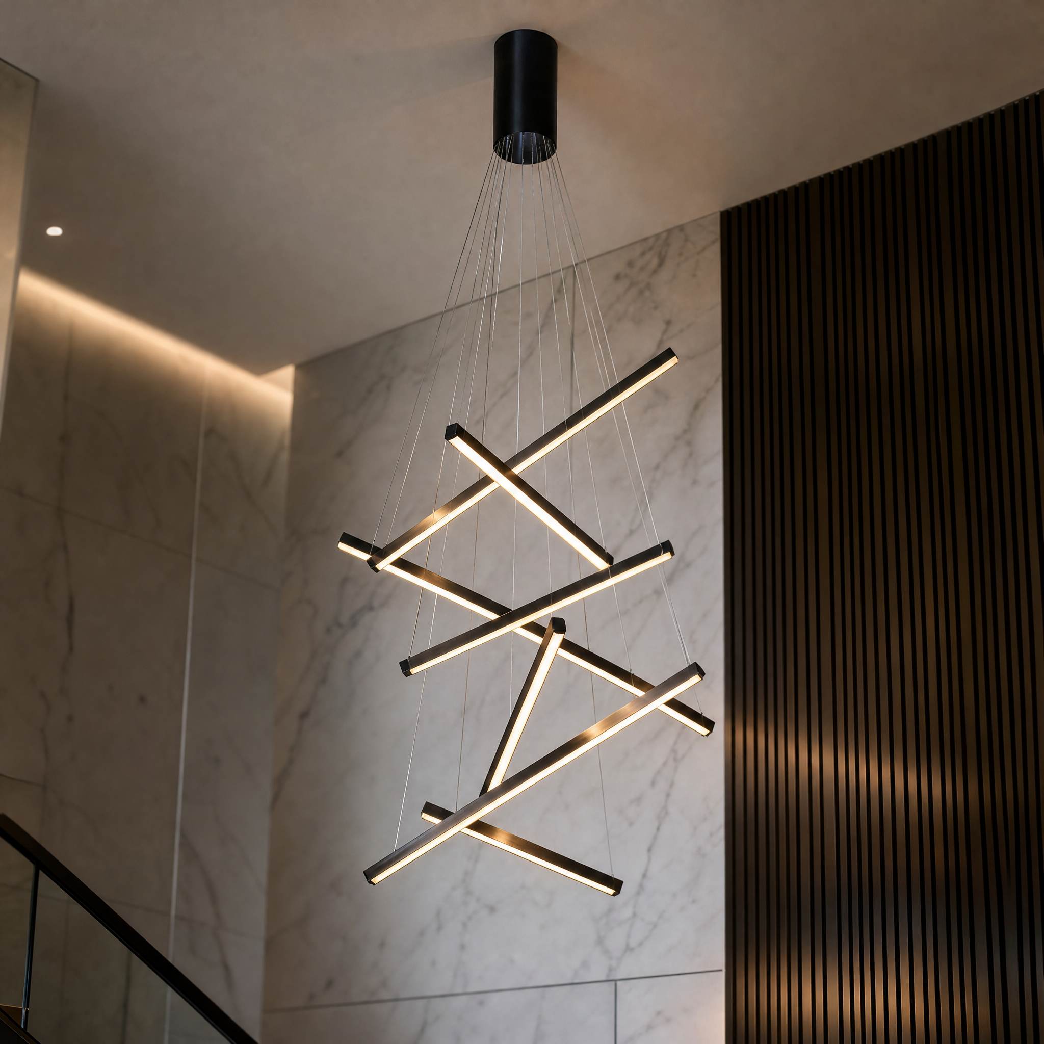 Detailed close-up of the adjustable linear LED pendants from the Vorelli Esher chandelier, emphasizing premium materials and sleek design.