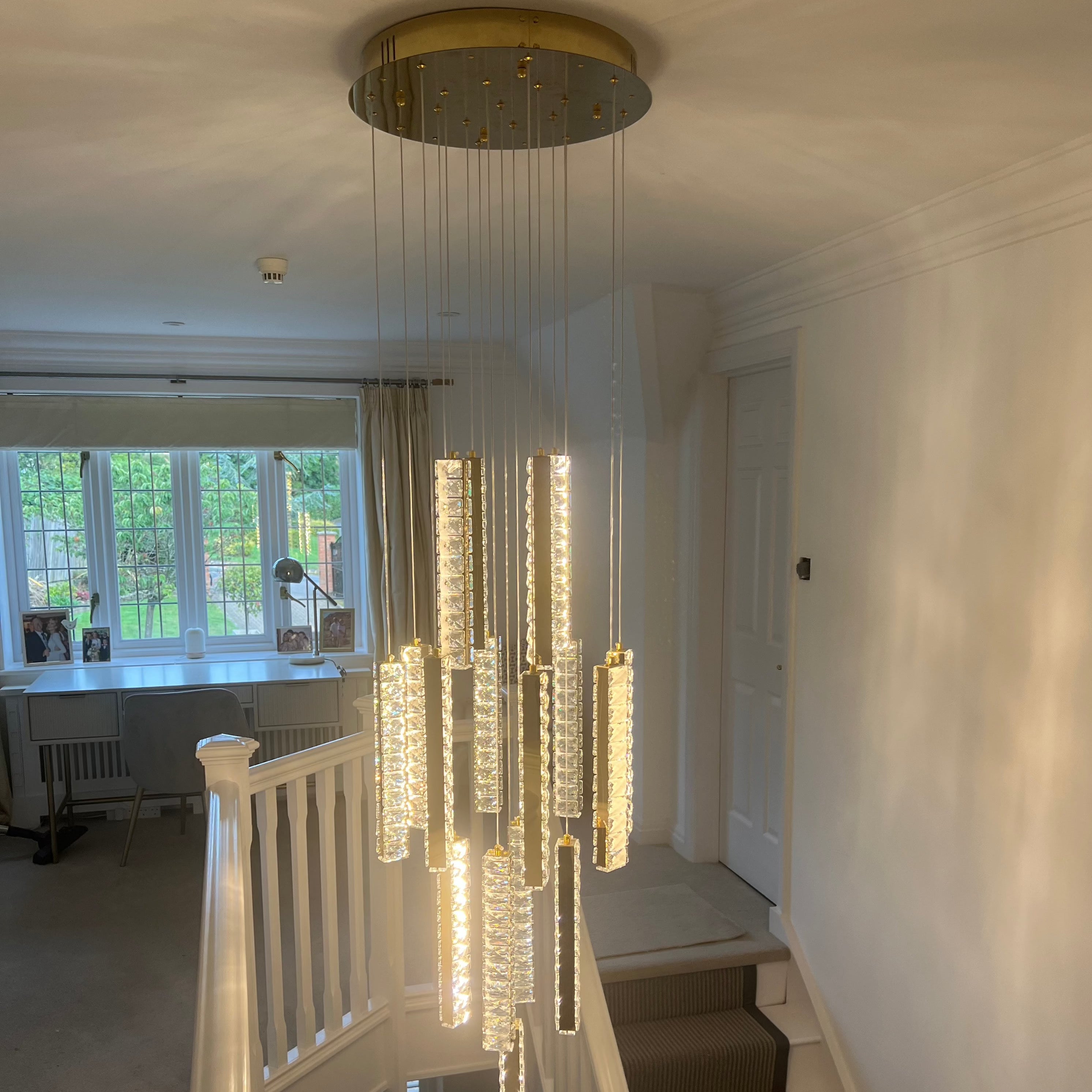 Fantasia pendant staircase chandelier cascading through multiple levels