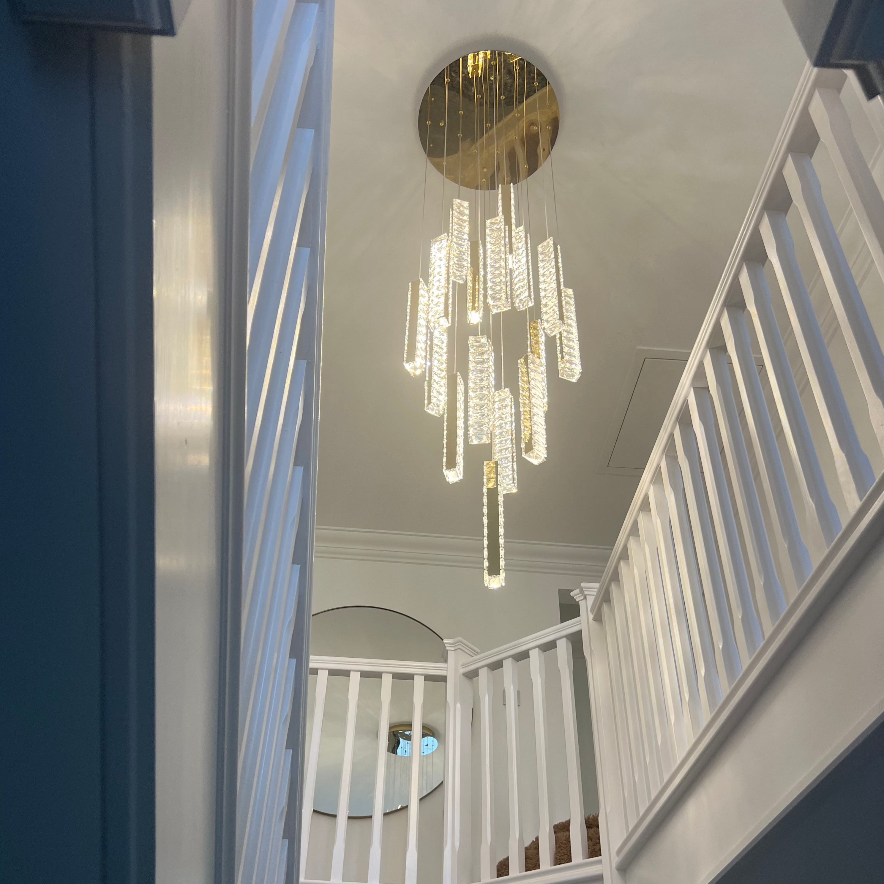 Long Fantasia staircase chandelier with vertical crystal pendants