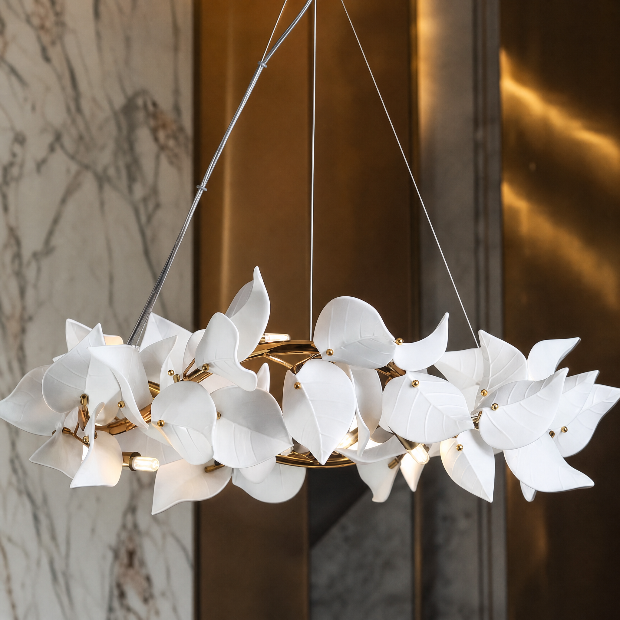 Macro closeup of the delicate sculptural floral elements on the VORELLI Fiorella Circular Chandelier, showcasing the layered design and intricate craftsmanship.