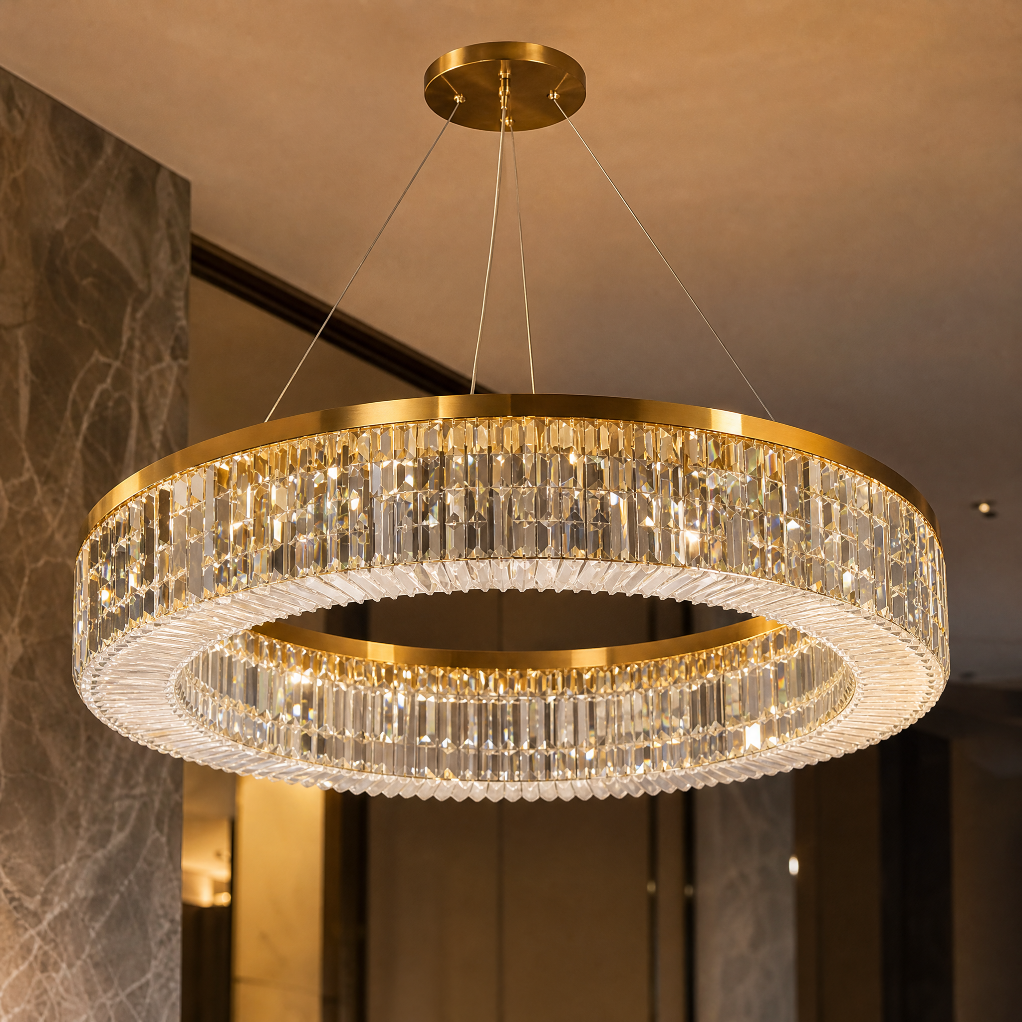 Detailed closeup of the VORELLI Fira circular chandelier, showcasing the precision-crafted crystal bars arranged in a stunning halo formation.