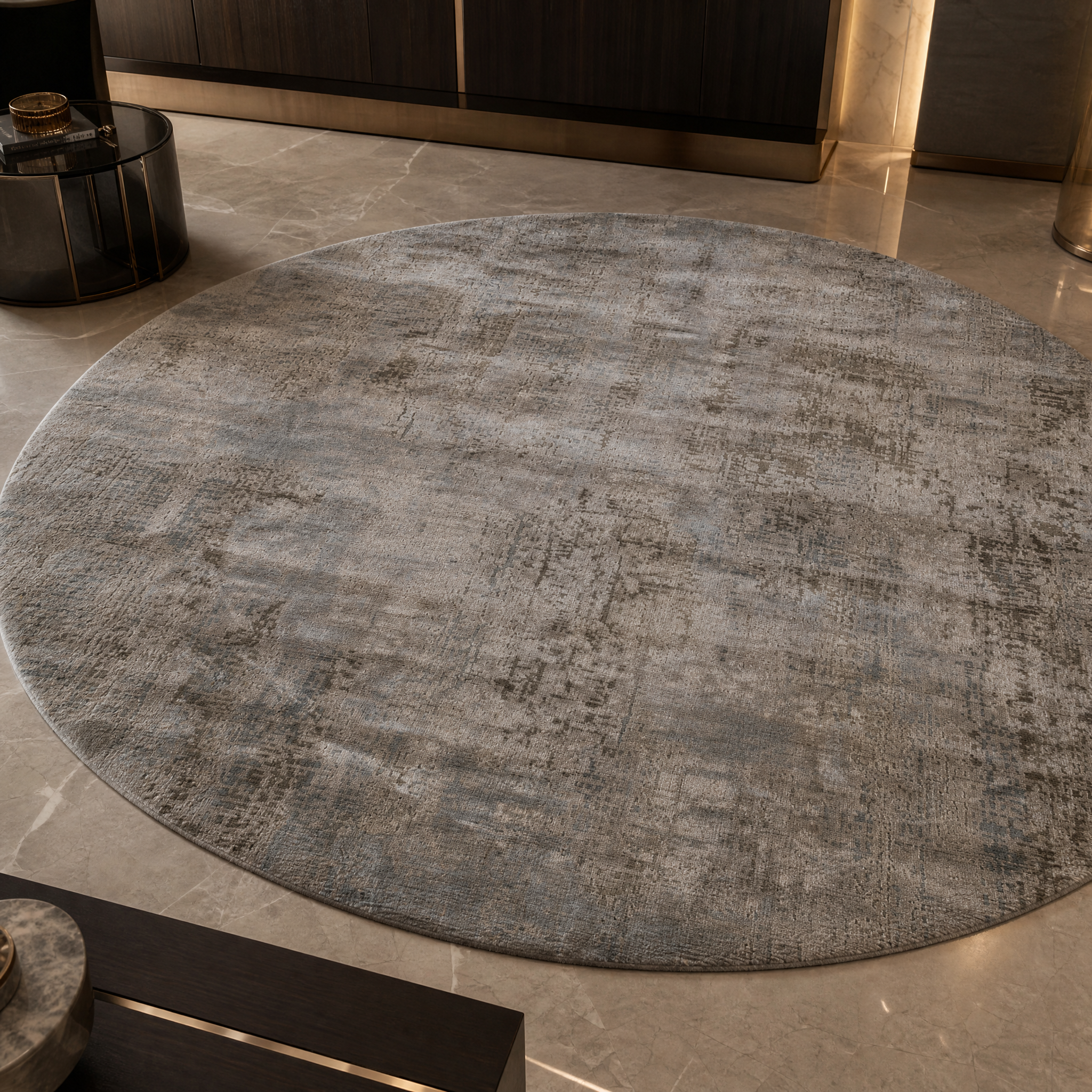 Close-up detail of the hand-knotted texture and soft antique white and ashwood fibers of the VORELLI Florenza circular rug.