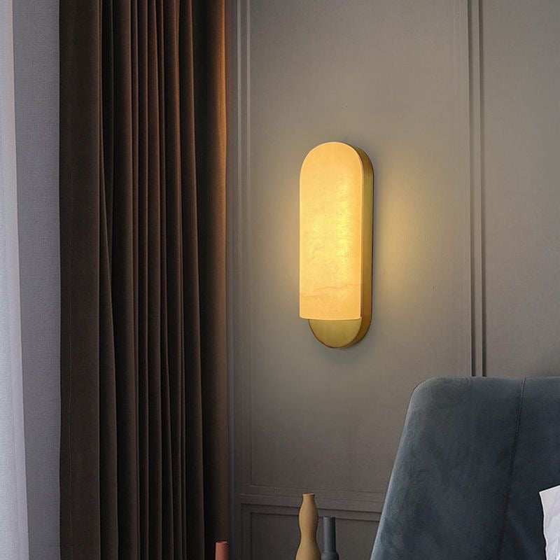 Formello marble wall light softly illuminating a luxury interior wall