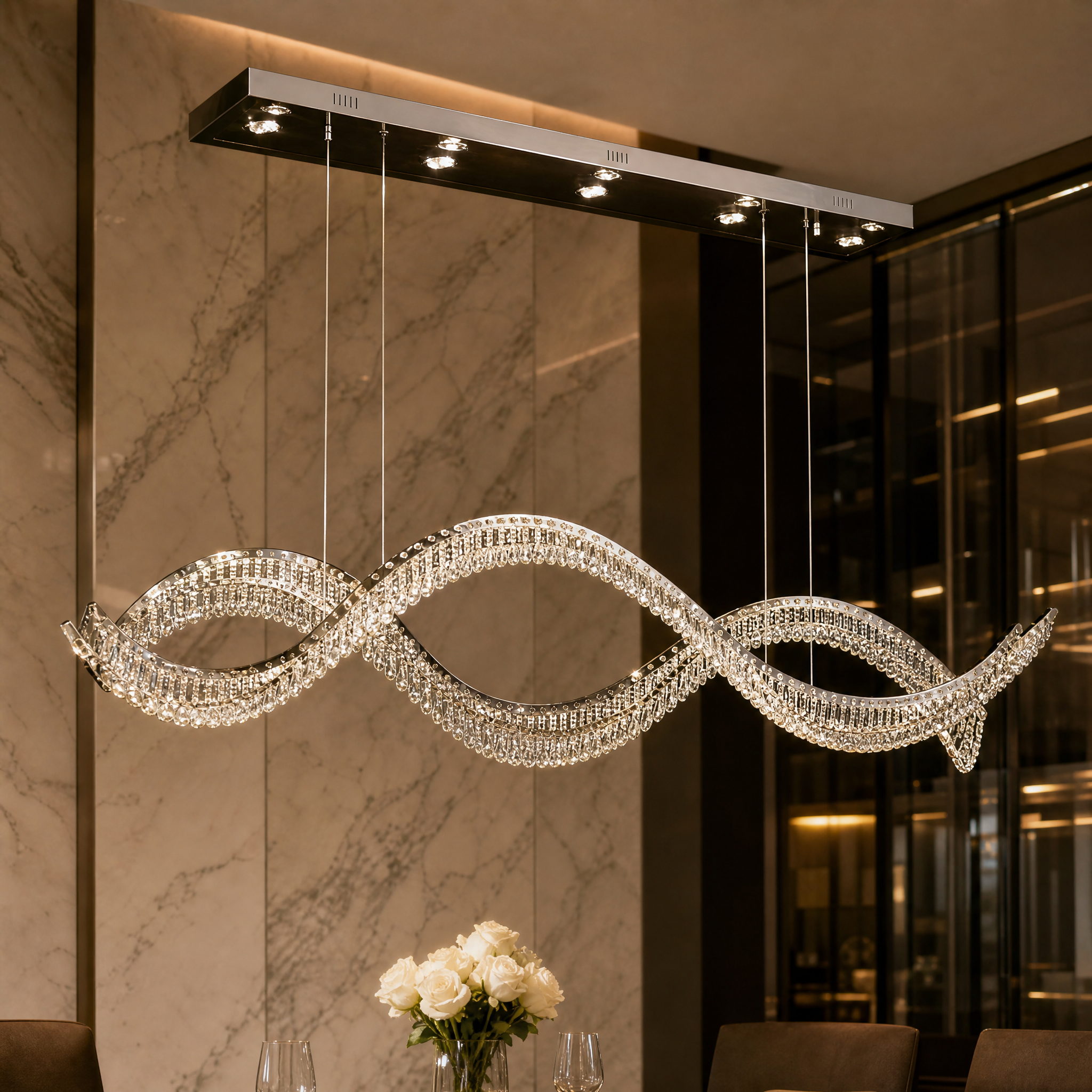 Macro close-up shot of the lustrous crystal pearls and creative flowing wave structure of the VORELLI Harbron Chandelier.