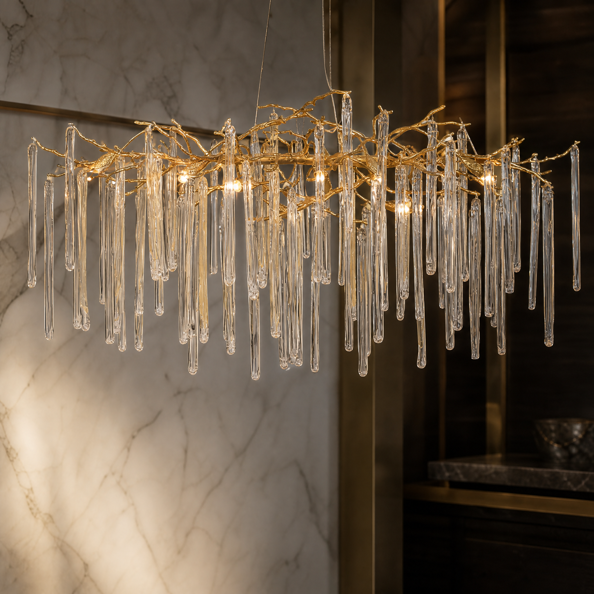 Close-up detail of the hand-formed glass icicles and artisanal branching frame of the VORELLI luxury chandelier.
