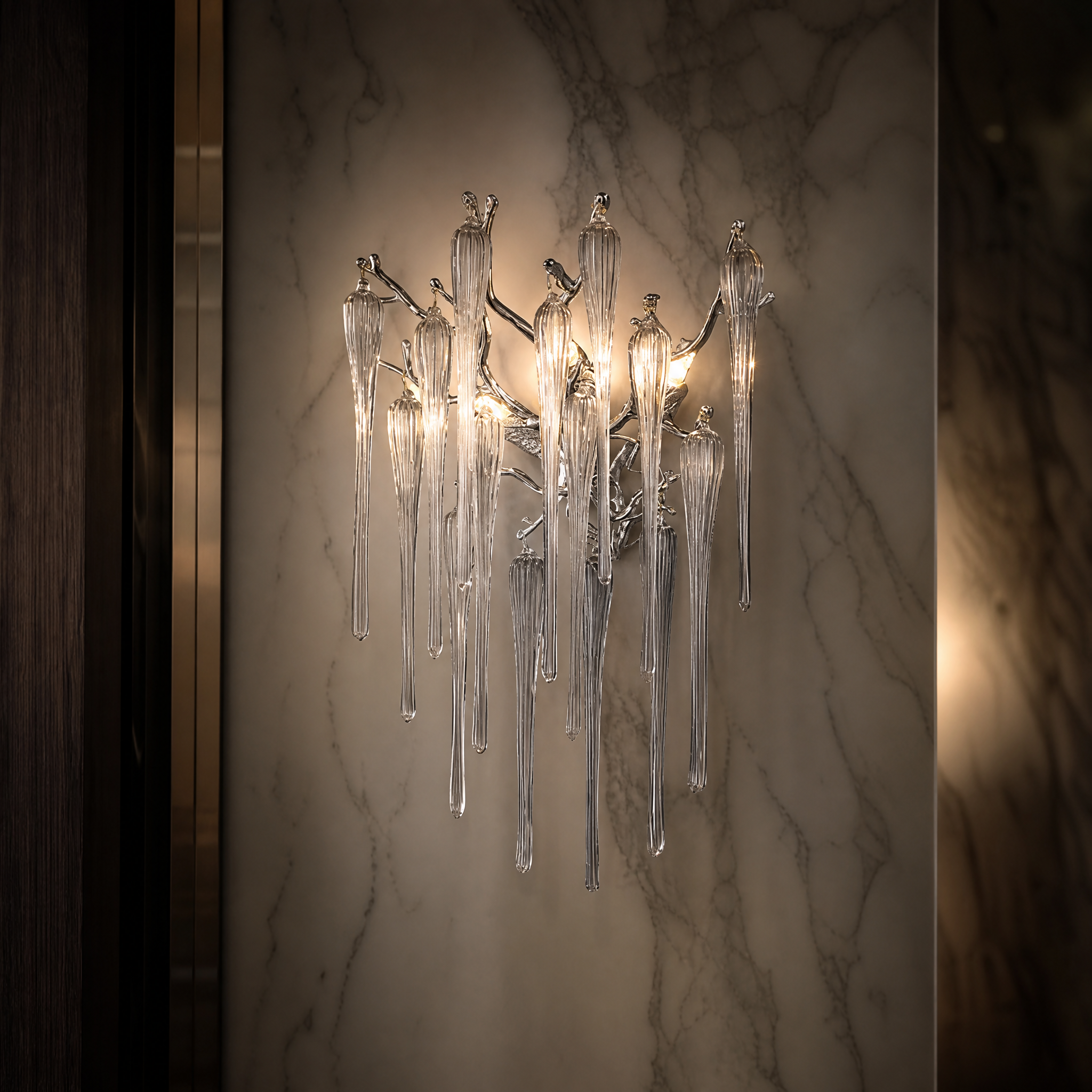 A detailed closeup of the VORELLI Icicle Wall Light, showcasing the unique hand-formed glass droplets and sculptural branch design.