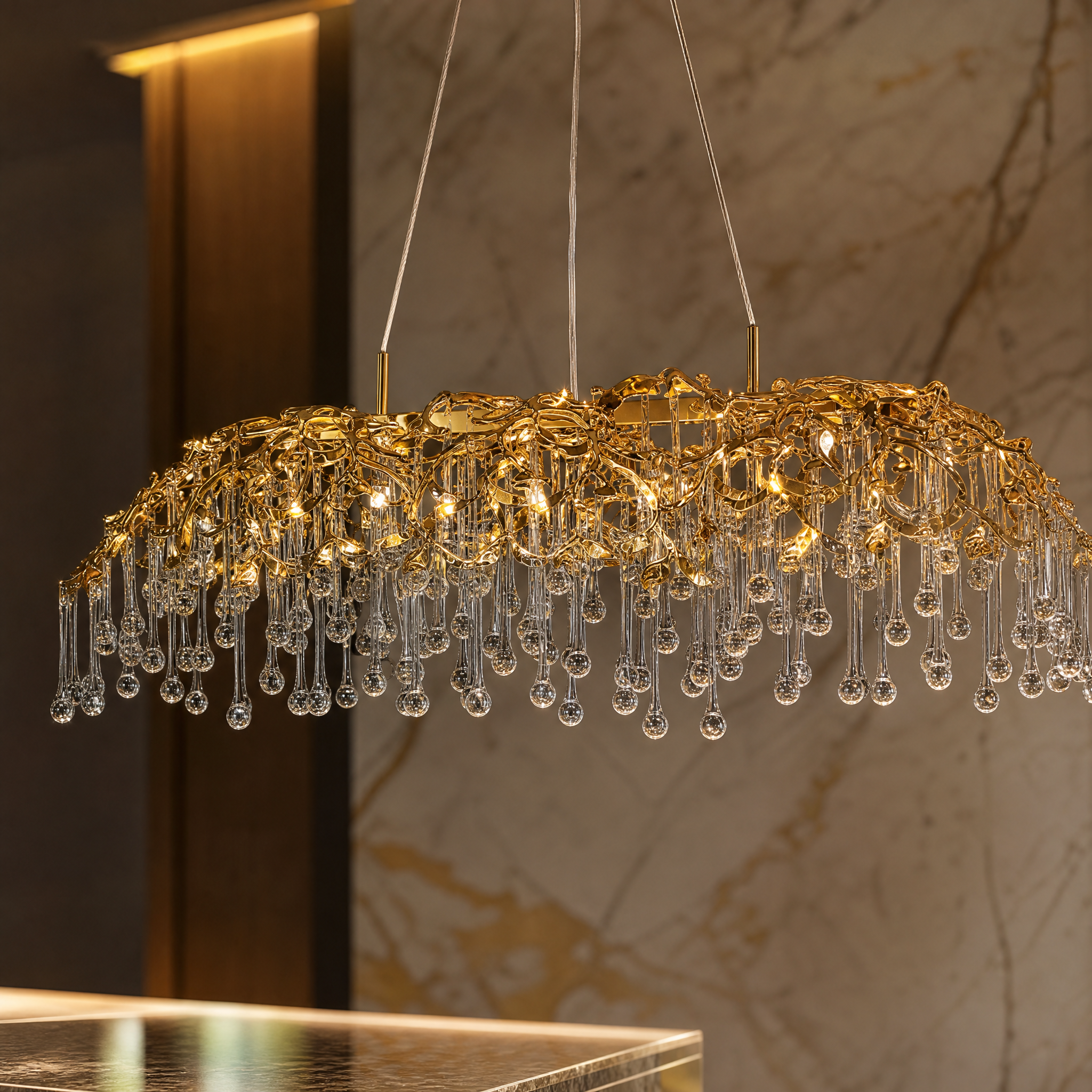Close-up shot of the sculptural metal branch work and cascading crystal drops on the VORELLI L’Albero d’Oro rectangular chandelier.