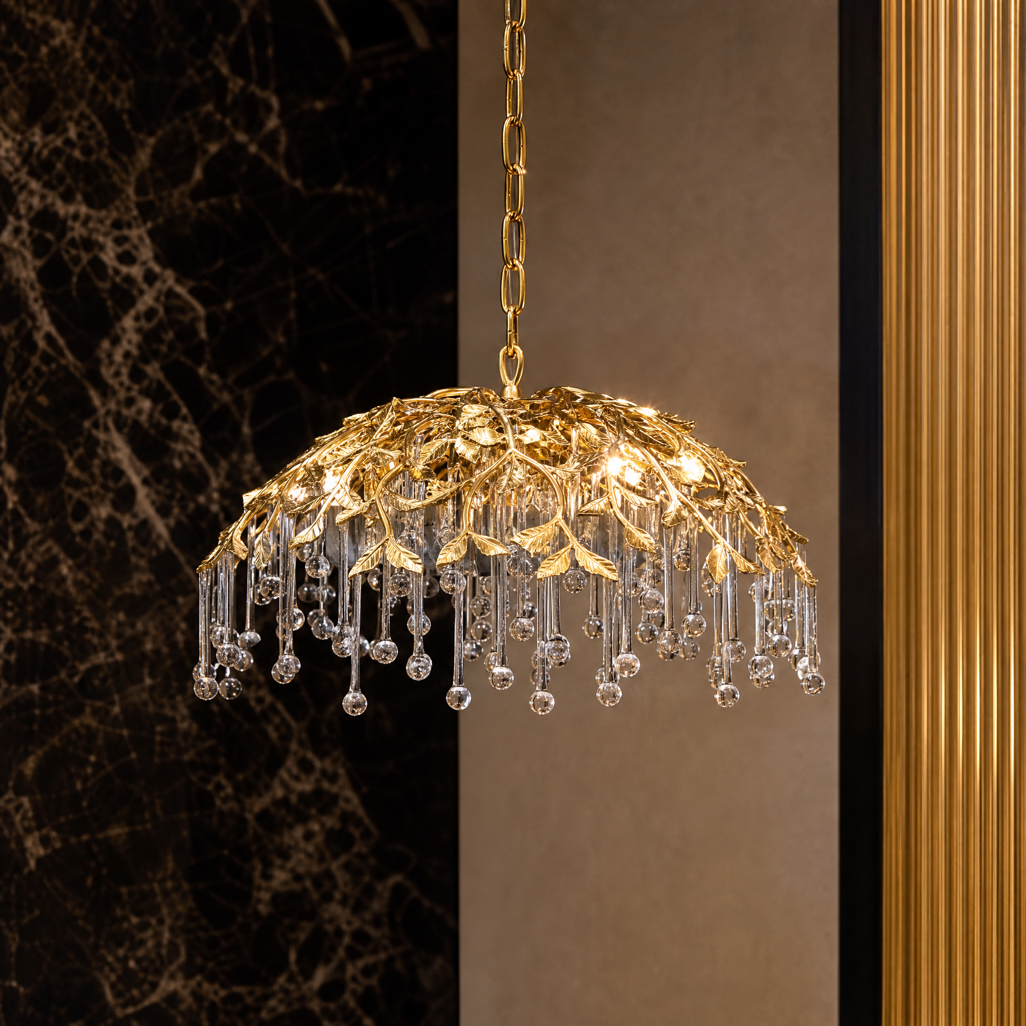 Macro closeup of the VORELLI L’Albero d’Oro pendant light, showcasing the exquisite detail of the elongated glass droplets and sculptural gold-finished metal branches.