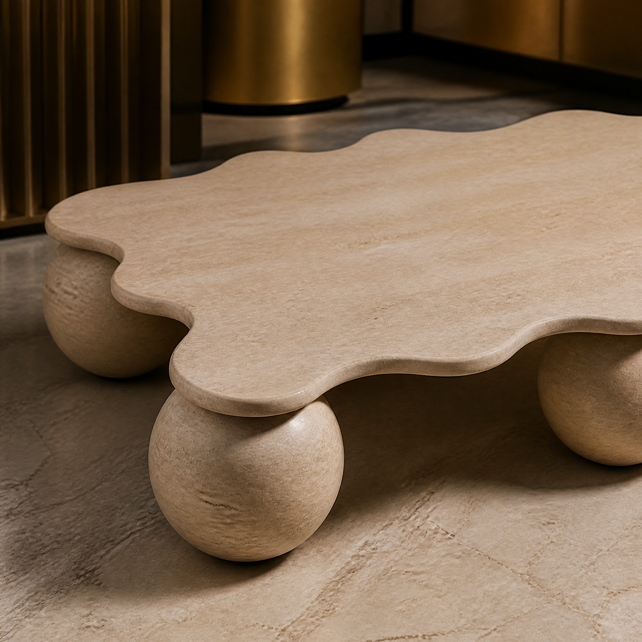 A close-up shot of the VORELLI Liburno coffee table highlighting the natural texture of the solid travertine top and spherical bases.