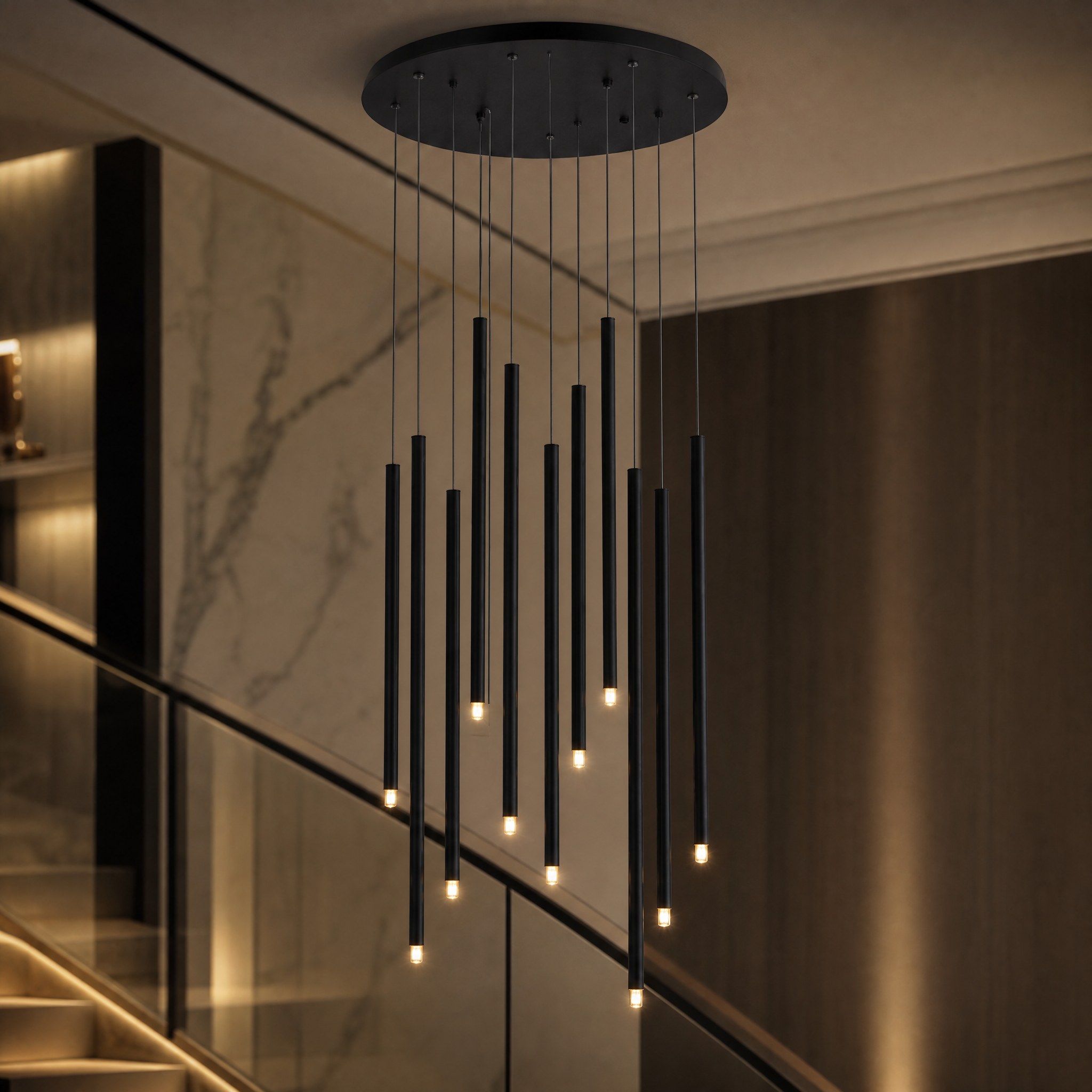 A detailed close-up of the VORELLI Liscio chandelier highlighting the refined contemporary aesthetic of its sleek cylinder pendants and premium finish.