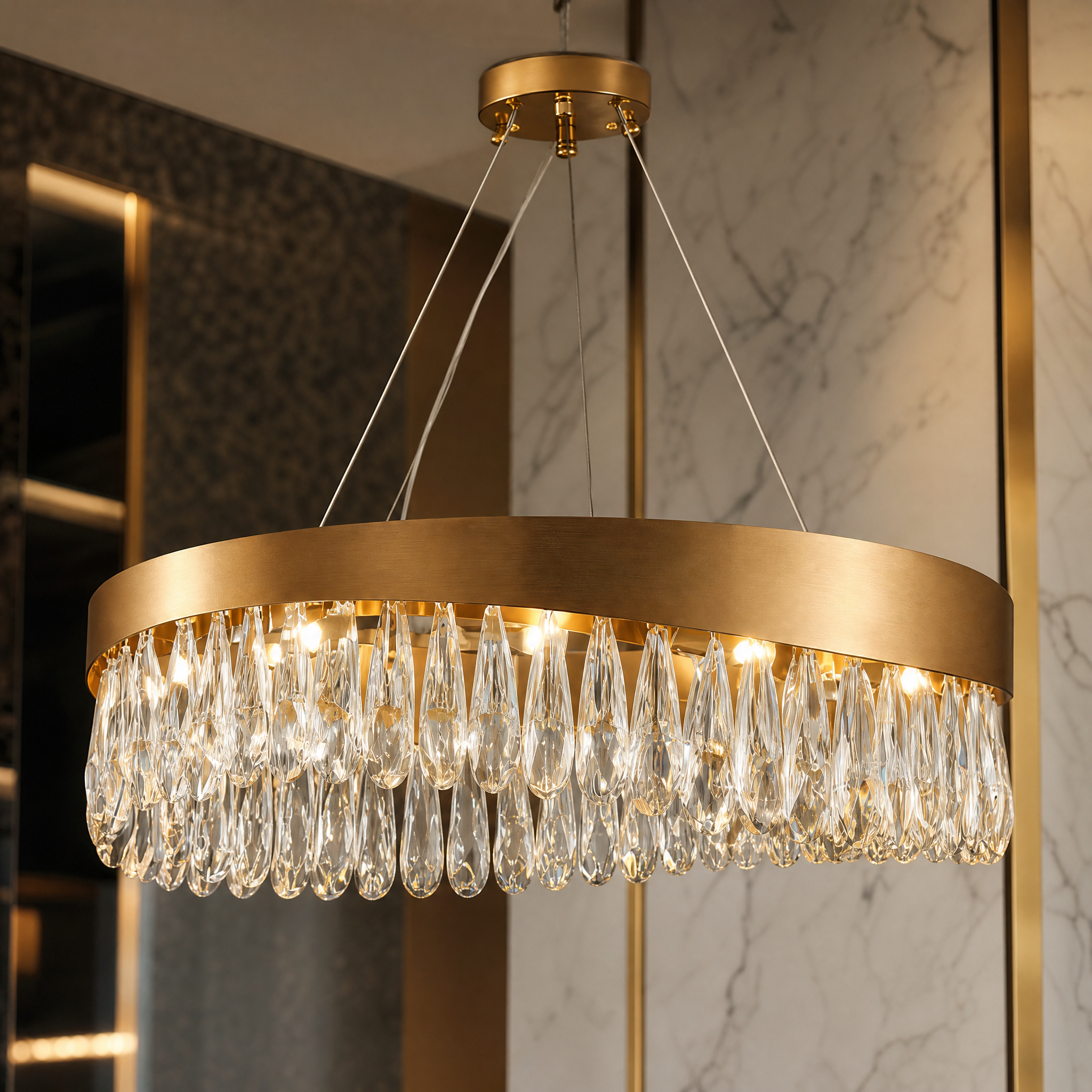 A detailed closeup of the VORELLI Lomazzo chandelier highlighting its brilliant, precision-crafted diamond cut teardrop crystals.