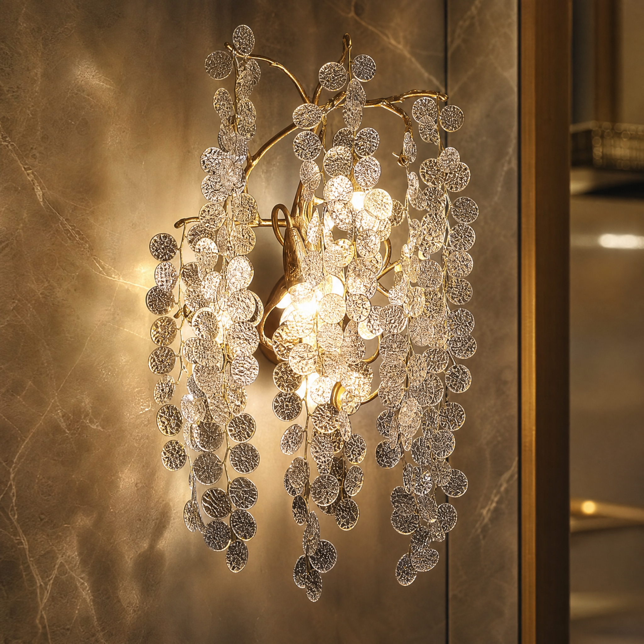 A macro closeup of the VORELLI Lunaria Wall Light, showcasing the intricate detail of the textured glass discs and the refined depth of the sculptural metal branches.