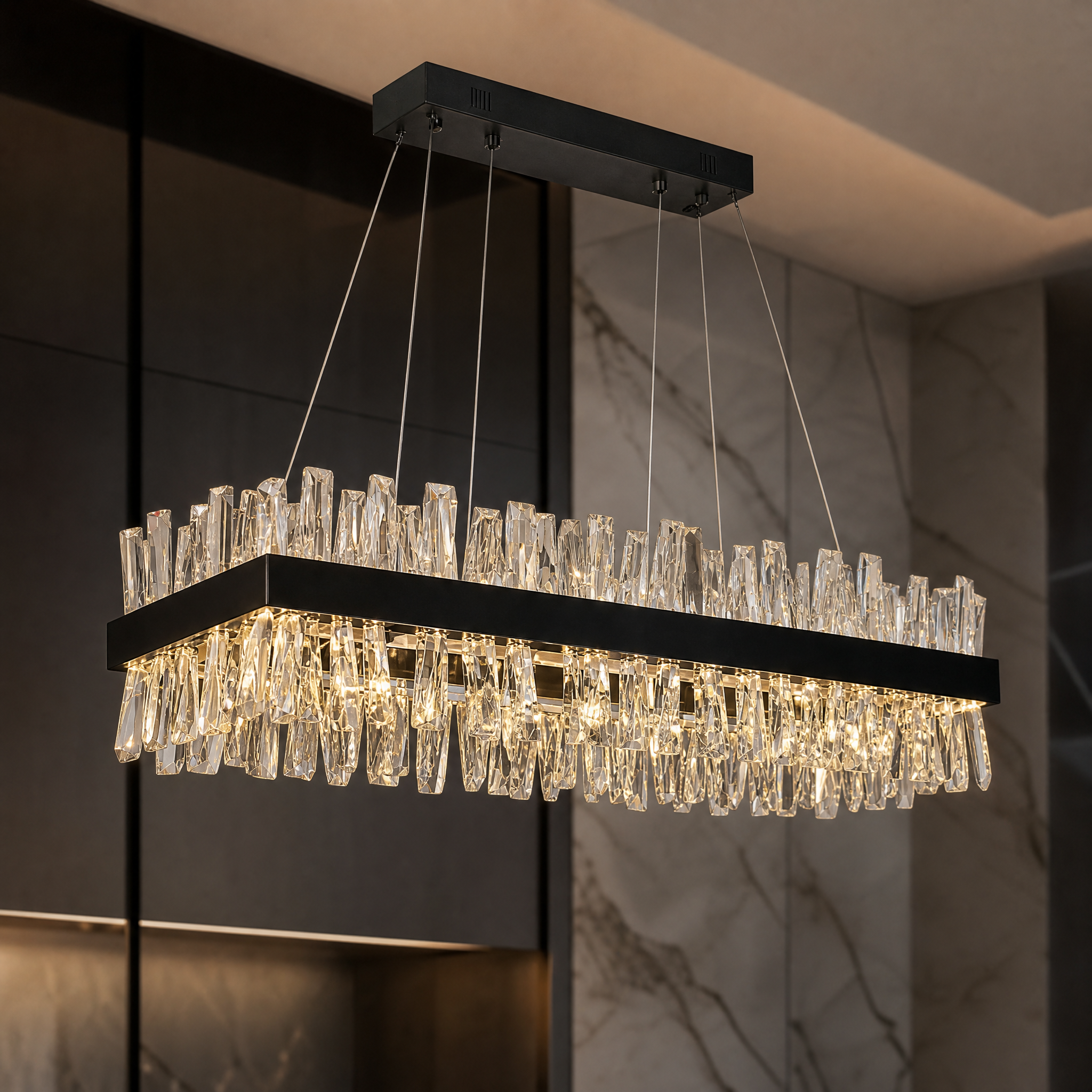 Macro shot of the angled crystal bars on the VORELLI Malahide chandelier, showing texture and light refraction.