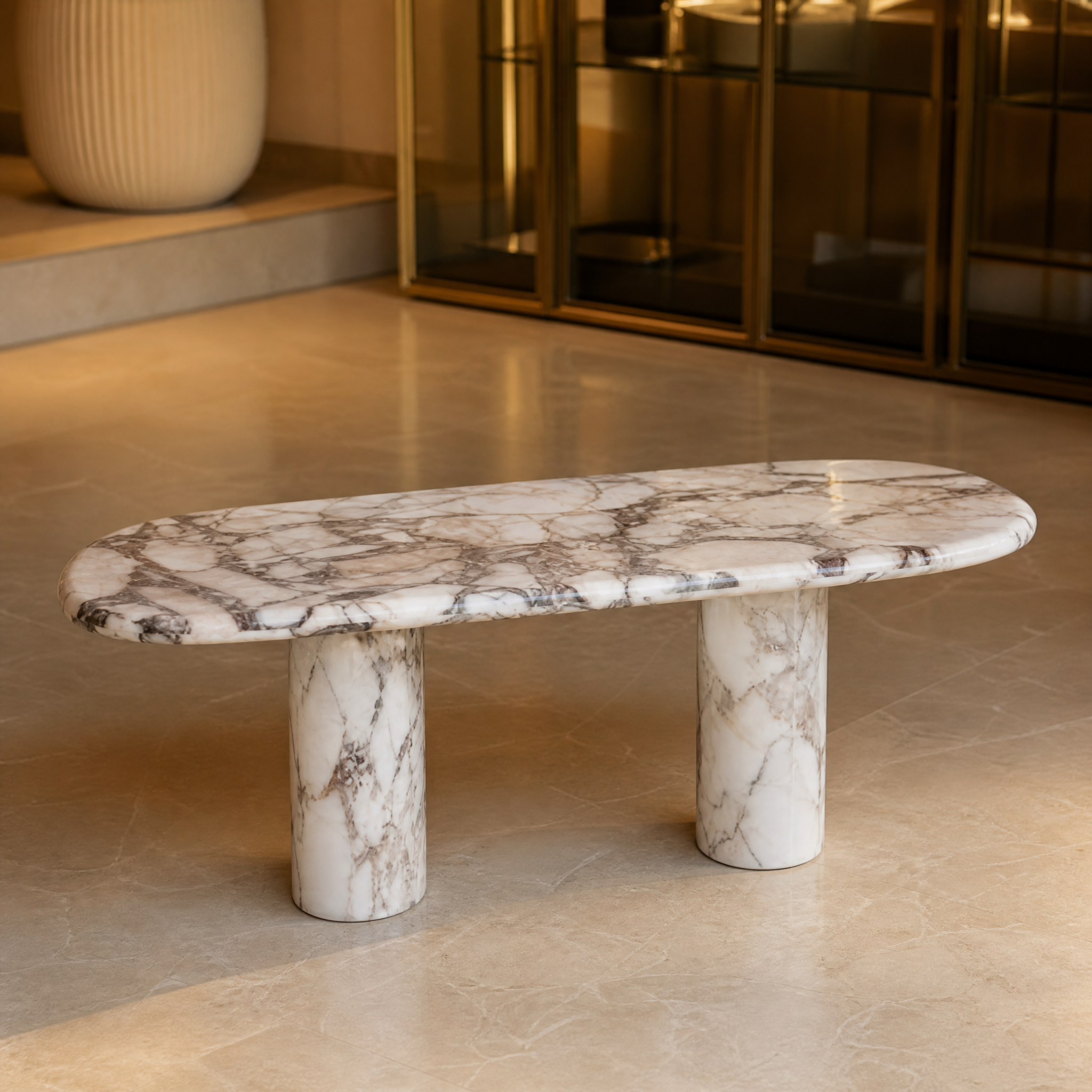 Macro closeup view of the eye-catching natural veining and organic texture on the solid elephant white marble surface of the VORELLI Malibino coffee table.