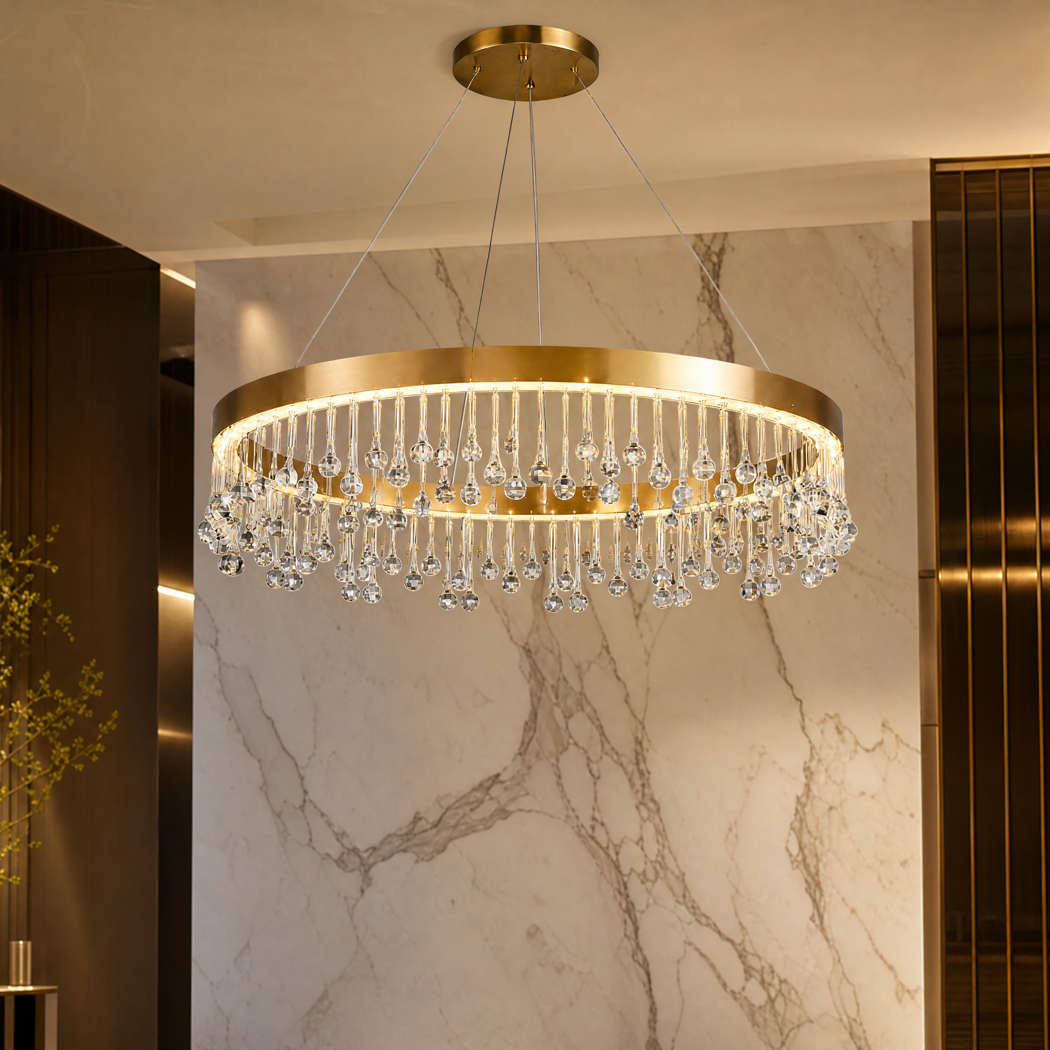 Close-up detail of the VORELLI Mancini chandelier showcasing the brushed stainless steel frame and artistic crystal droplets.