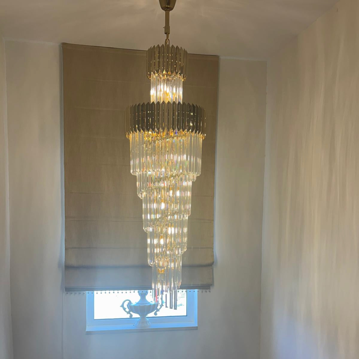 Manhattan crystal stairwell chandelier by VORELLI® enhancing a modern staircase with elegant vertical illumination and refined luxury ambiance.