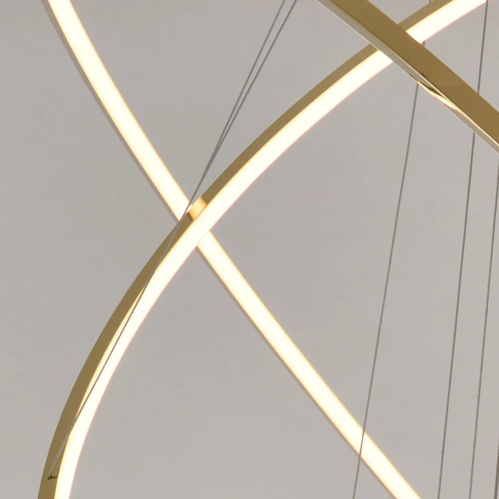 Close-up of illuminated circular LED frame detailing on the VORELLI Marcello staircase chandelier