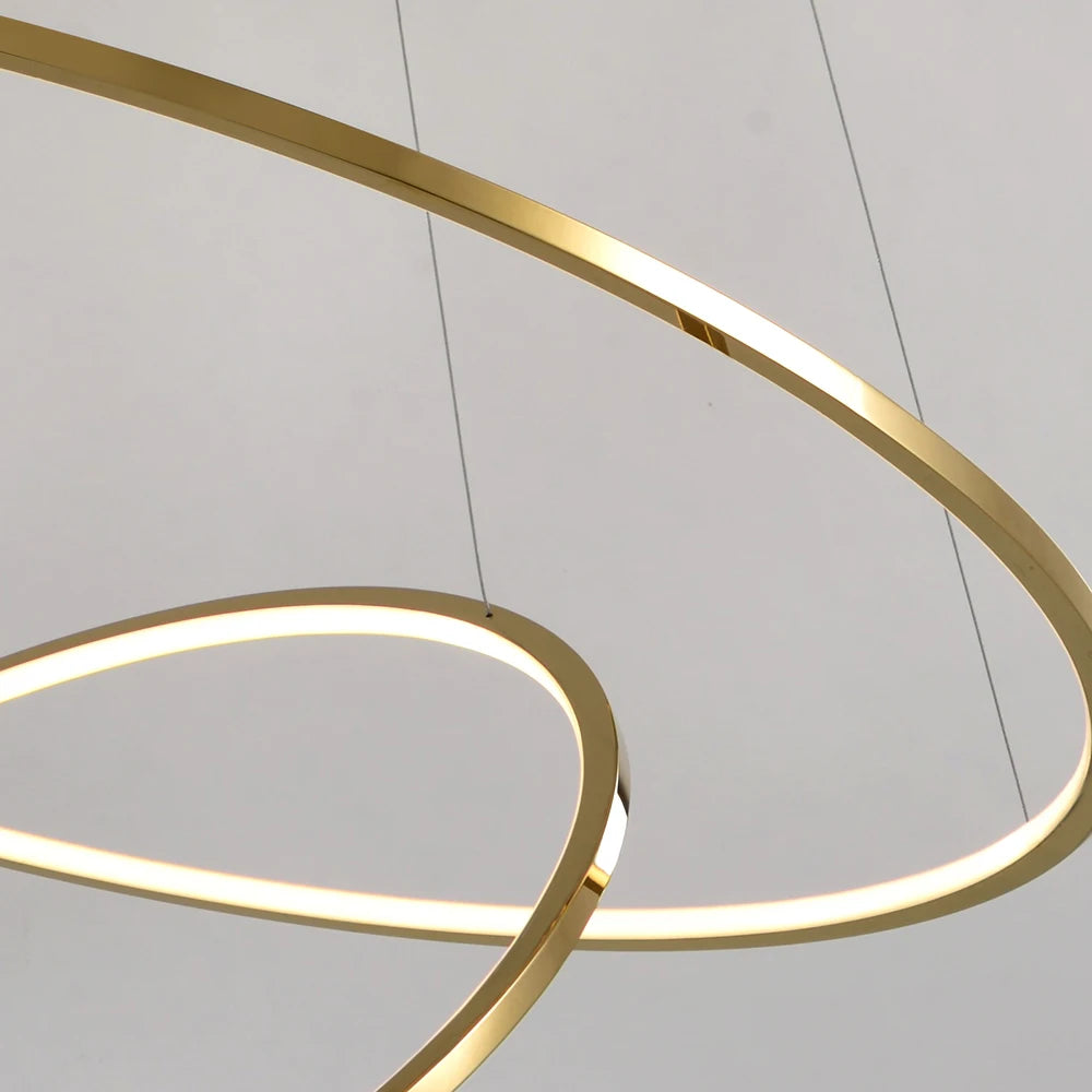 Detailed view of glowing LED ring edge on the Marcello staircase chandelier by VORELLI