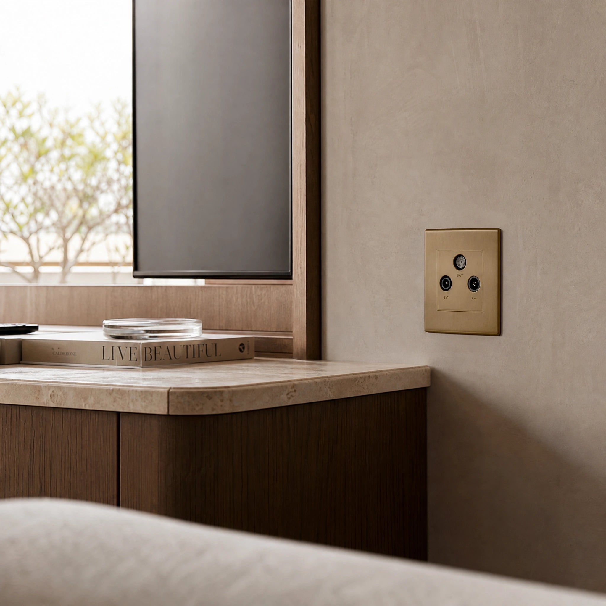 Luxury antique brass media outlet installed within bespoke media wall or integrated TV joinery in a private residence in a UHNW interior by VORELLI®.