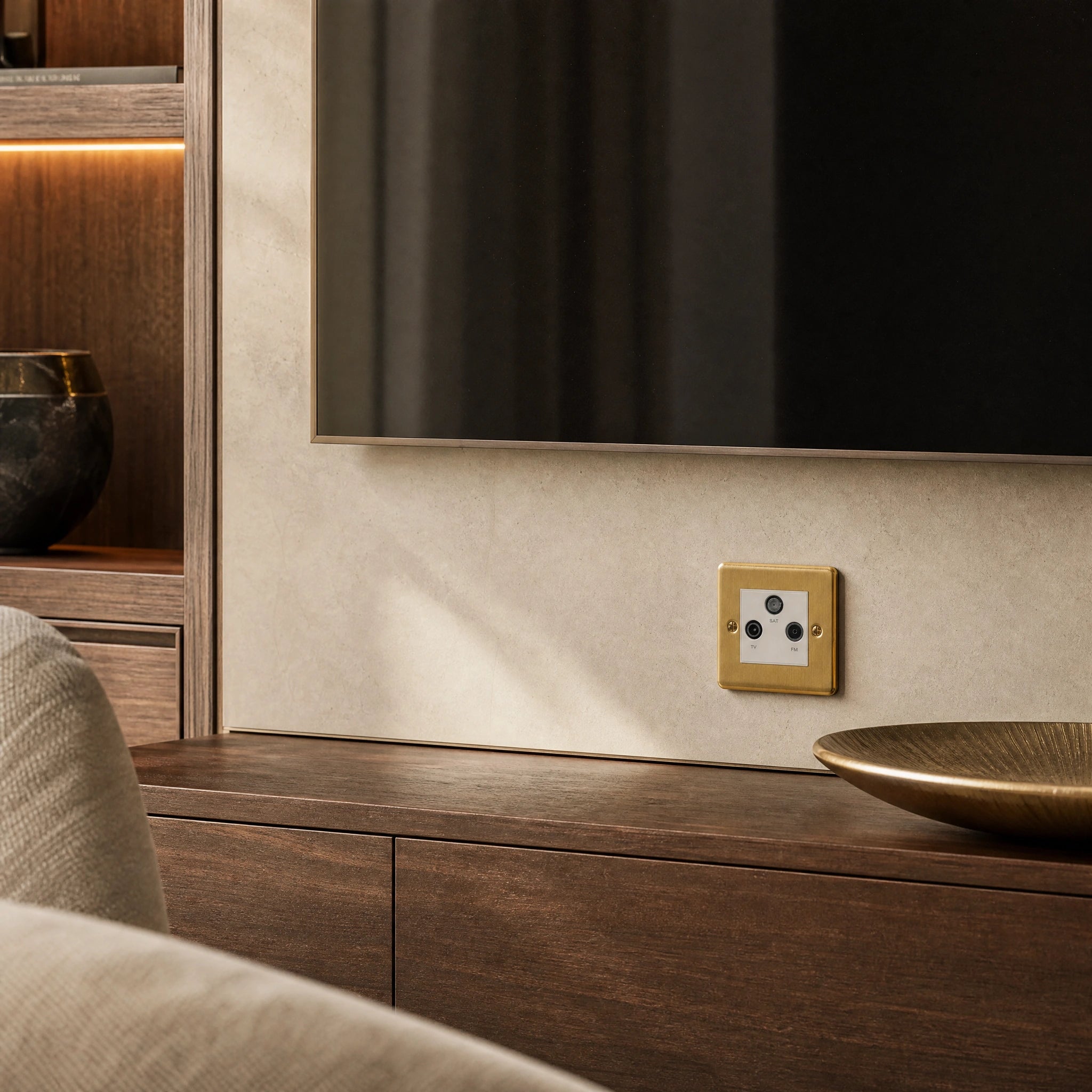 Luxury antique brass media outlet installed within bespoke media wall or integrated TV joinery in a private residence in a UHNW interior by VORELLI®.