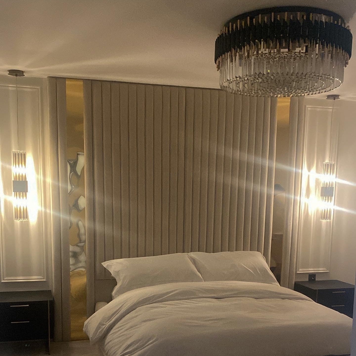 VORELLI Milltimber crystal ceiling light creating a warm ambient glow in a luxury bedroom interior