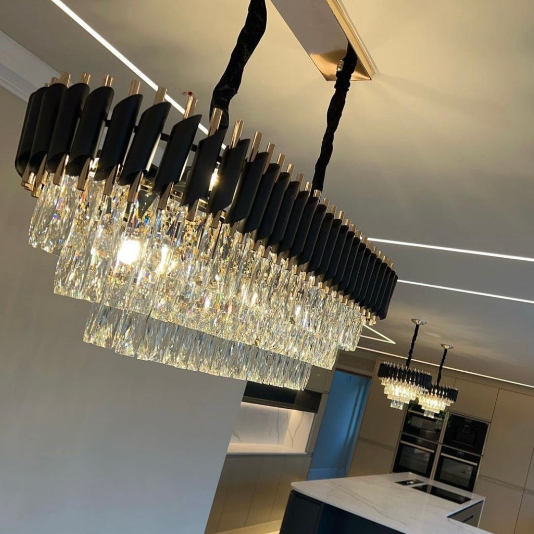 VORELLI® Milltimber rectangular chandelier suspended above bar area in luxury interior setting with cascading rectangular crystal drops