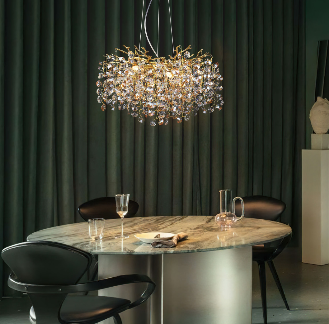 Mimosa circular chandelier styled above a luxury dining table in a modern interior