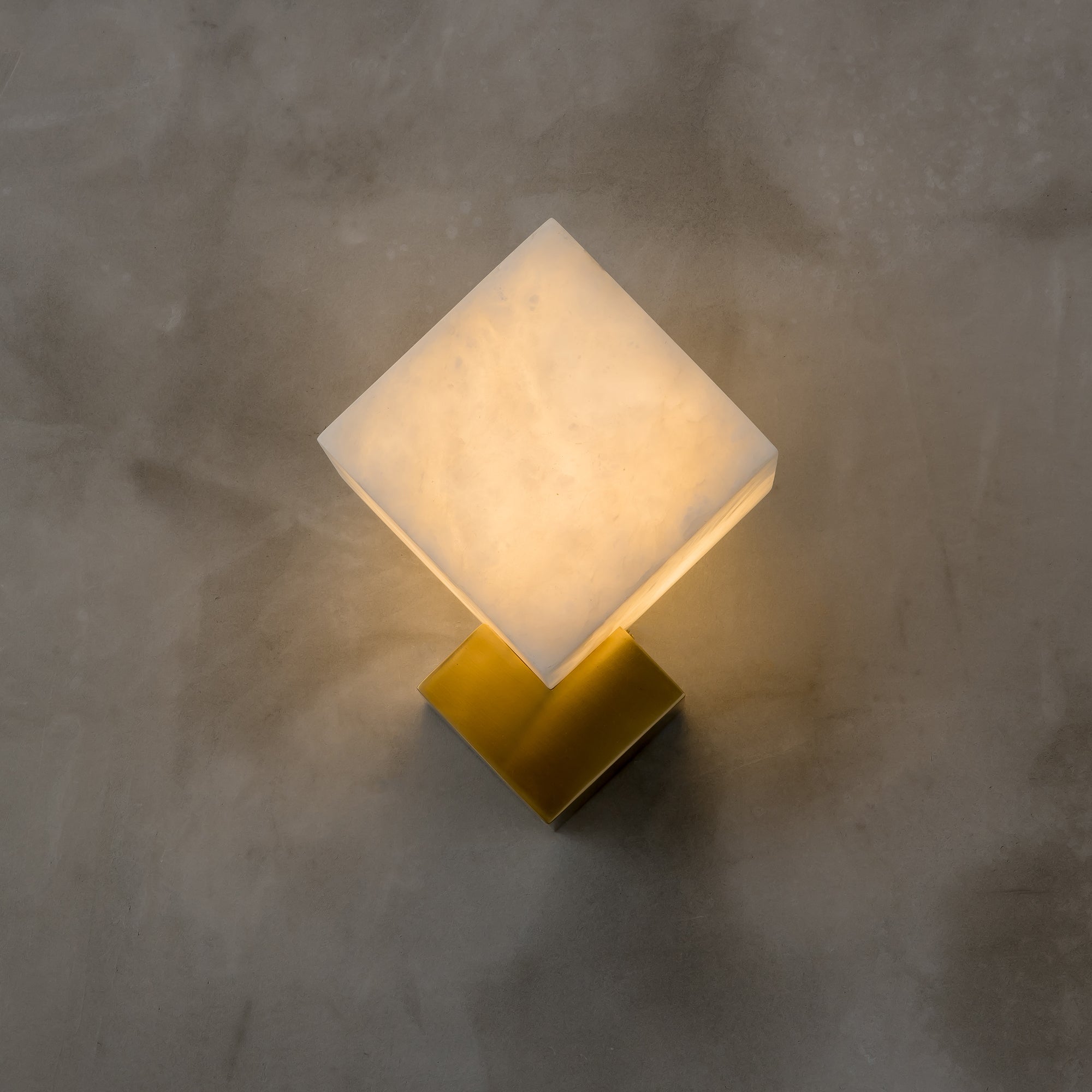 VORELLI® Modena alabaster wall light installed on textured wall creating warm ambient glow in contemporary interior