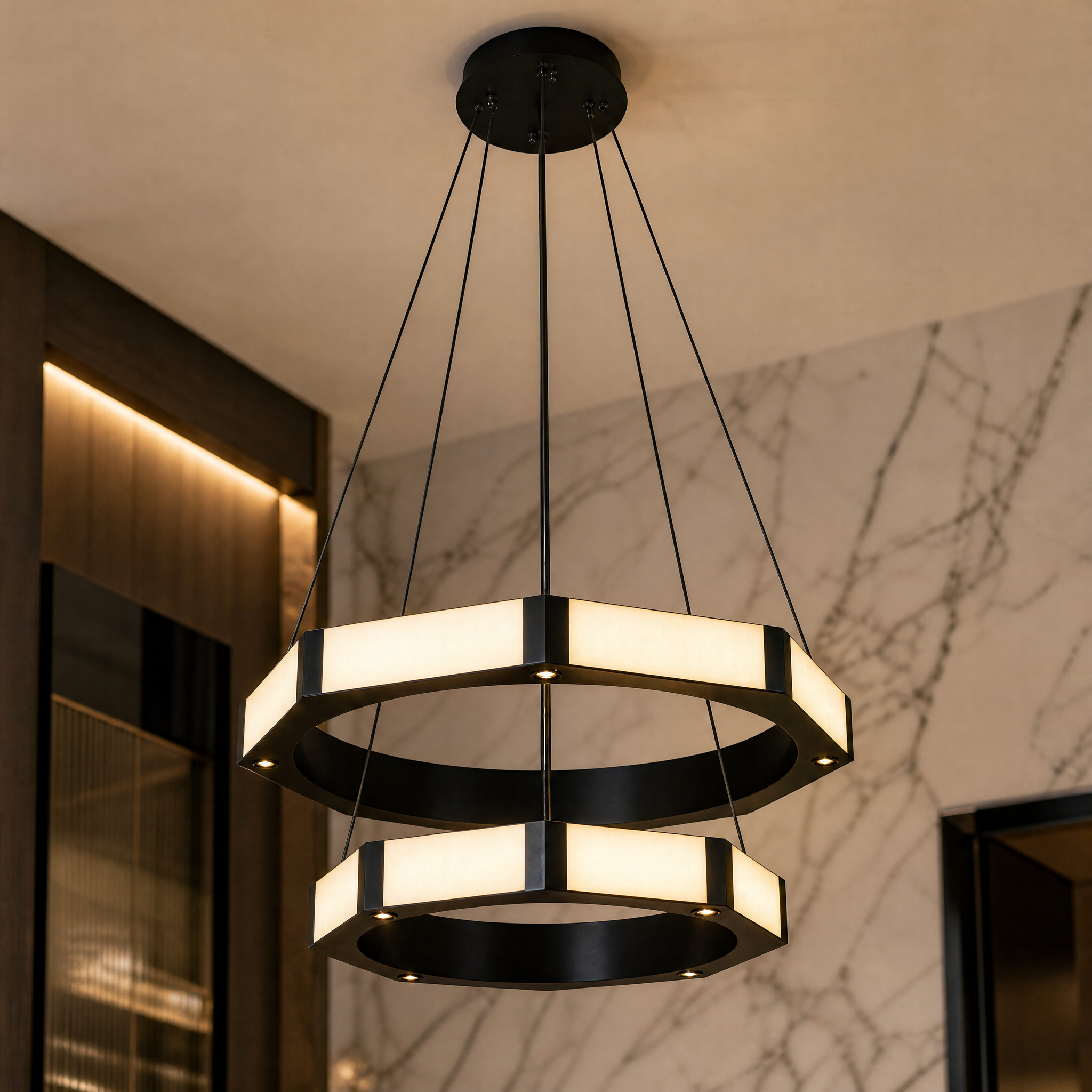 A detailed macro closeup of the Nero Double Ring Chandelier showing the seamless transition between marble and black frame.