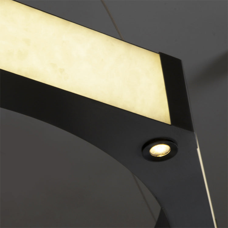 Detailed view of illuminated marble panel within VORELLI® Nero double ring chandelier