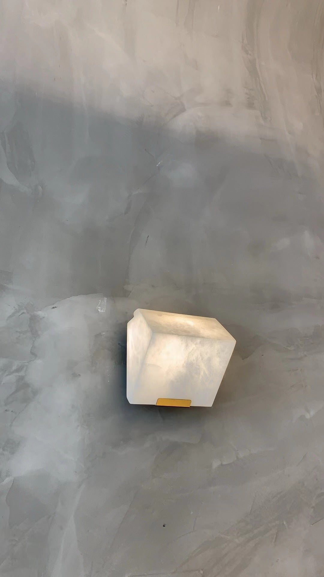VORELLI® Novara alabaster wall light mounted on textured wall enhancing contemporary architectural space