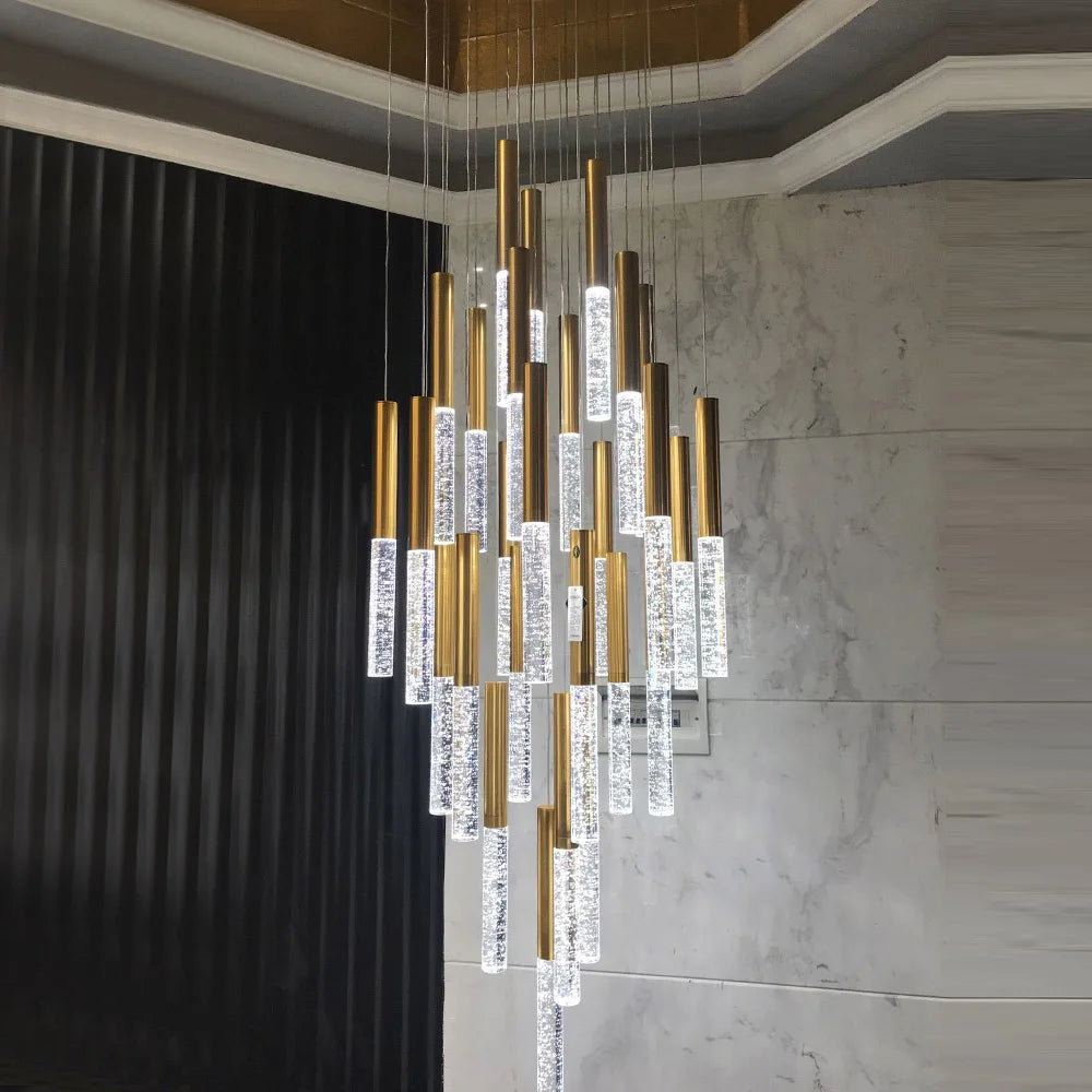 Tiered vertical crystal cylinders forming a sculptural modern staircase chandelier