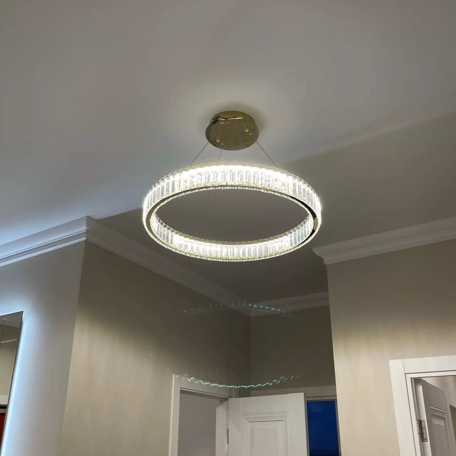 VORELLI® Oia circular ring chandelier casting soft halo illumination across ceiling surface