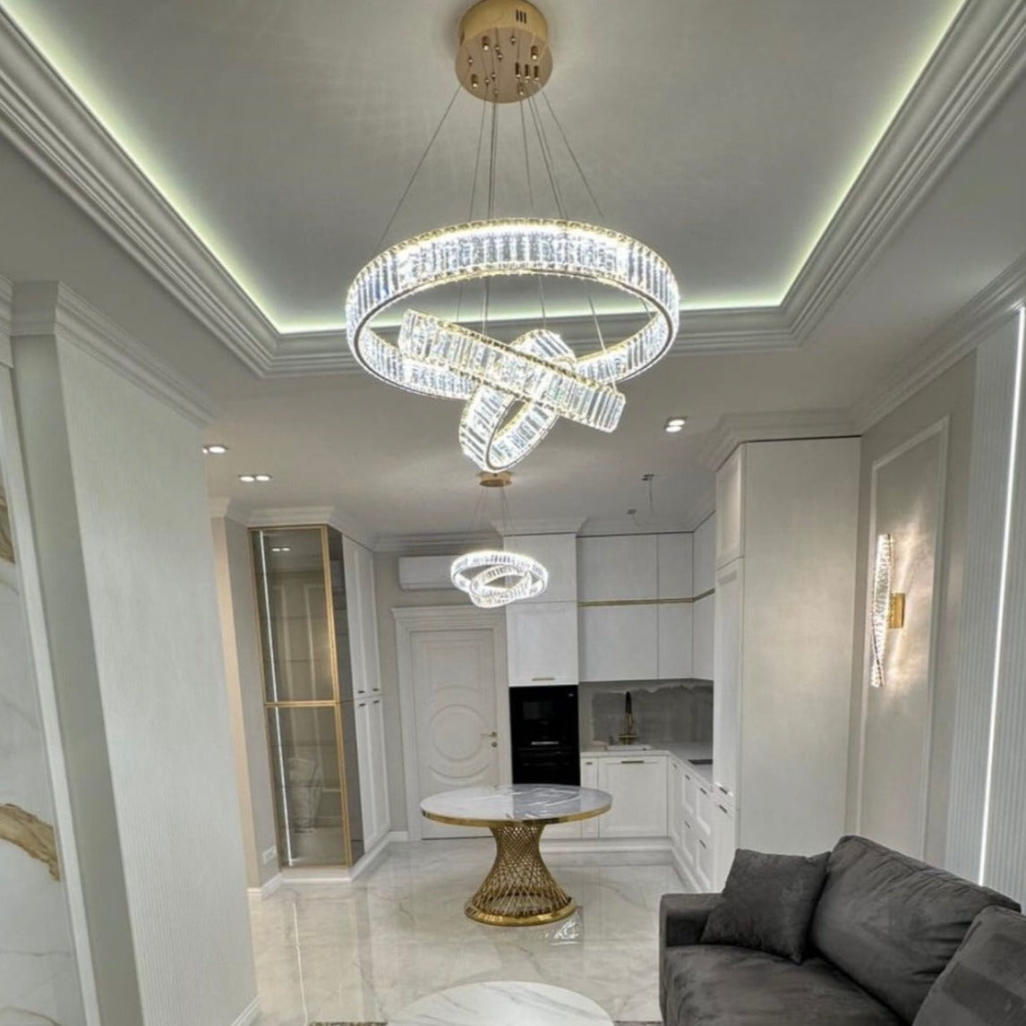 VORELLI® Oia three ring chandelier installed in contemporary living space with layered halo crystal design