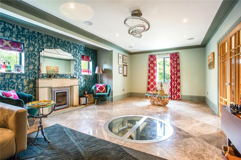 Close up underside view of VORELLI® Oia trio ring circular chandelier highlighting layered halo rings and integrated crystal bars