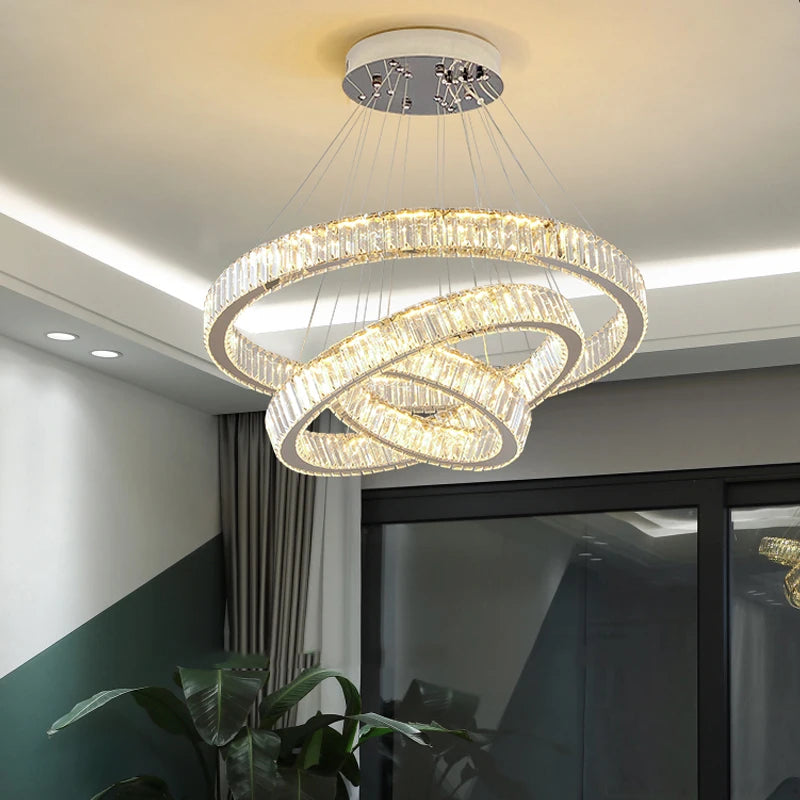 Close up of crystal bars arranged around layered halo rings on VORELLI® Oia trio ring chandelier