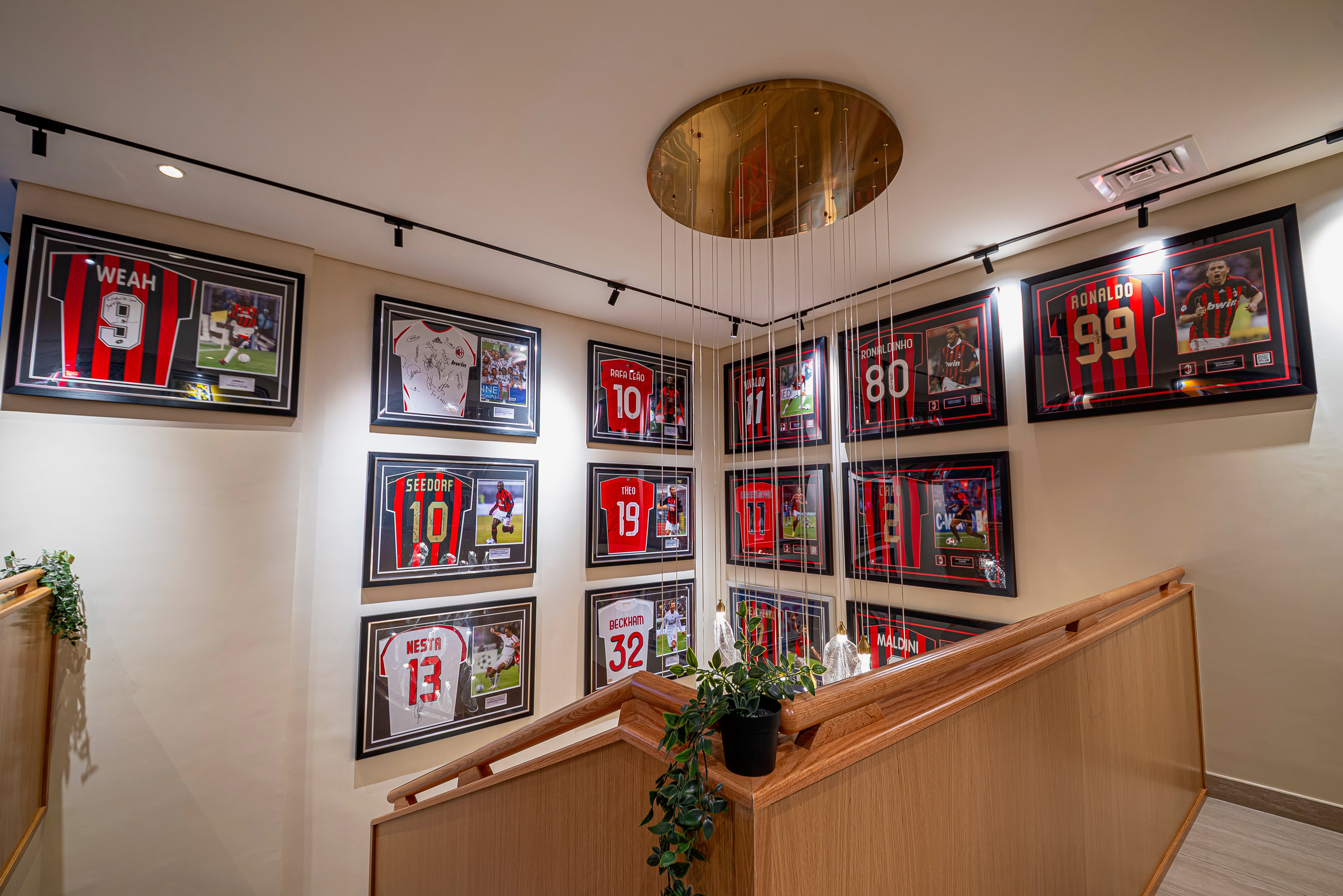 Installed VORELLI® Ottobre luxury pendant stairwell chandelier creating elegant ambient illumination within a refined interior