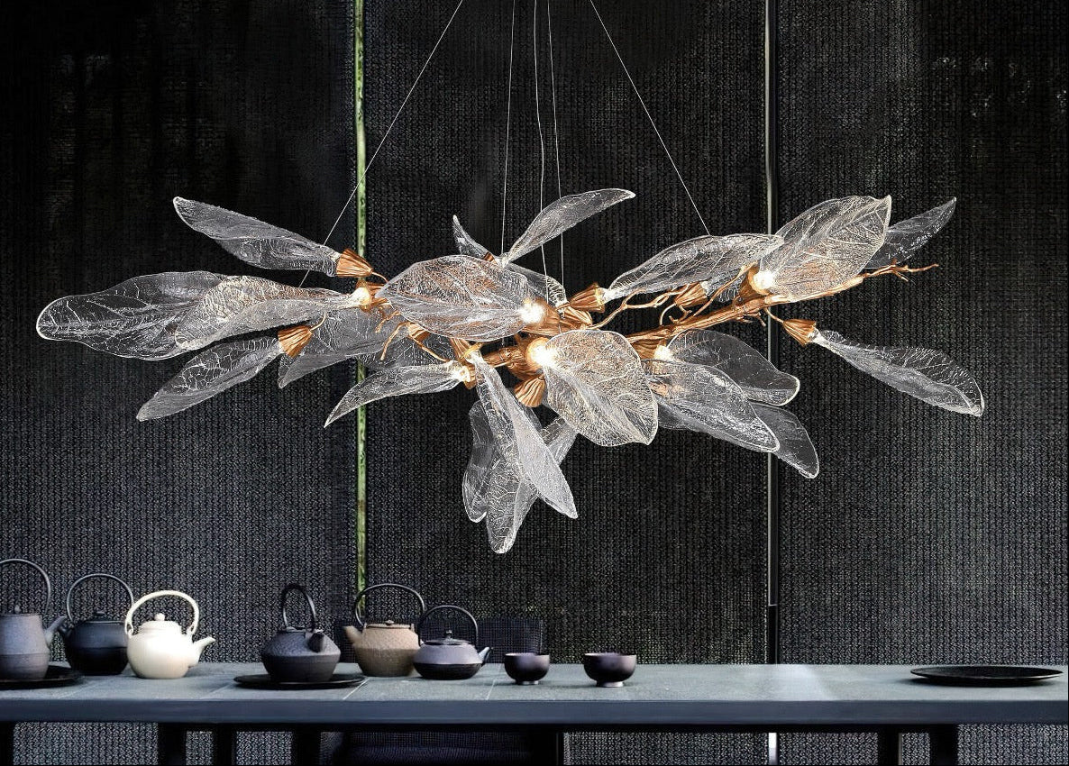 VORELLI® Ottobre modern rectangular glass leaf chandelier suspended above dining table creating soft ambient glow