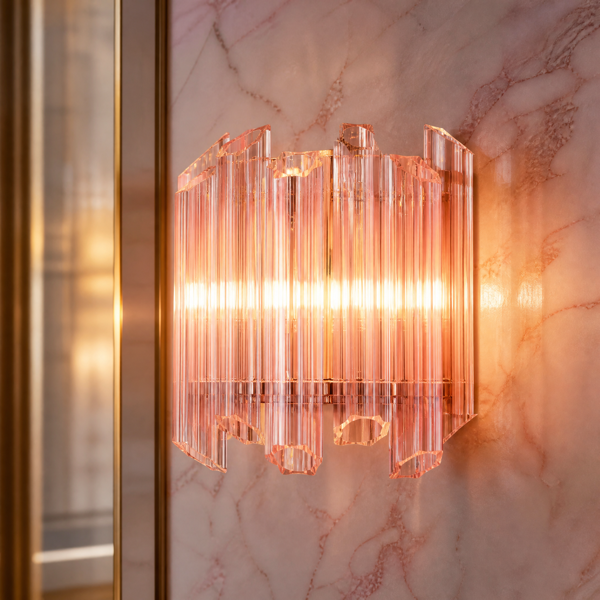 Macro closeup of the VORELLI Pink Palermino wall light showcasing the exquisite hexagonal pink glass tubes and nickel-plated iron frame.