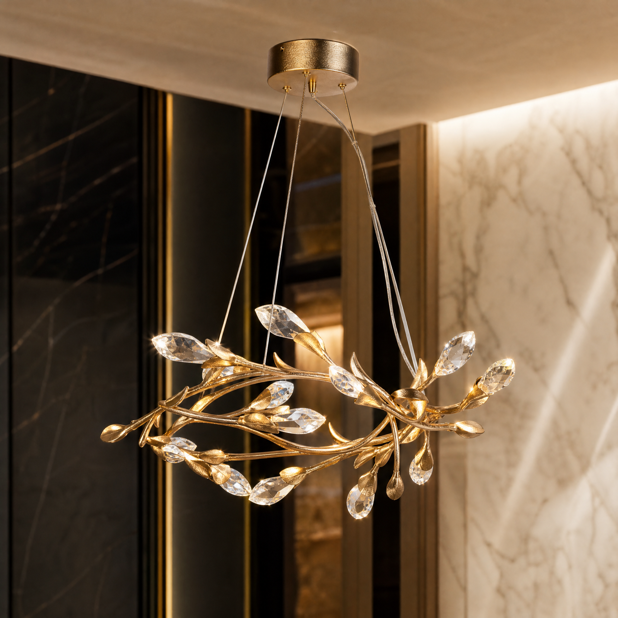 Detailed close-up of the VORELLI Ramozza chandelier showing the intricate flowing branch forms and finely faceted crystal accents.
