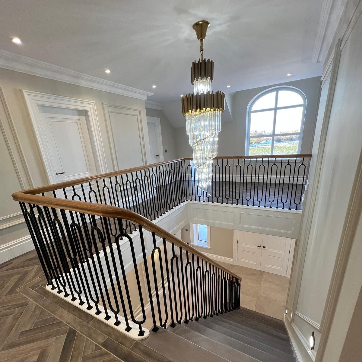 VORELLI luxury staircase chandelier in double height residential interior ready to ship UK