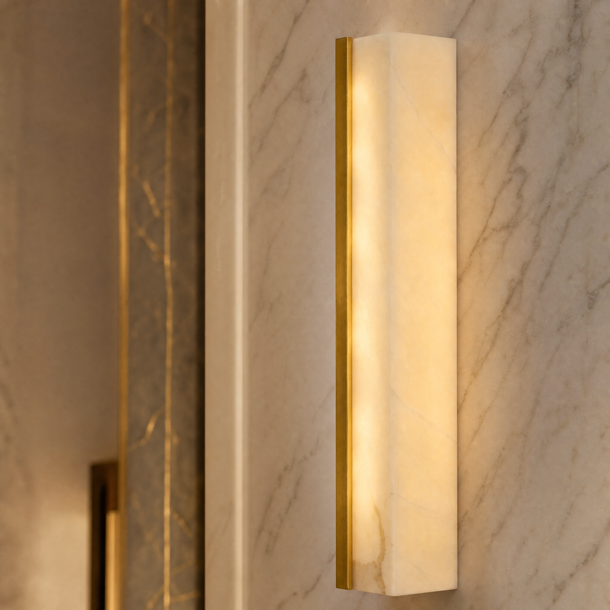 Detailed closeup of the premium marble vein and metal accents on the Vorelli Revo Wall Light.
