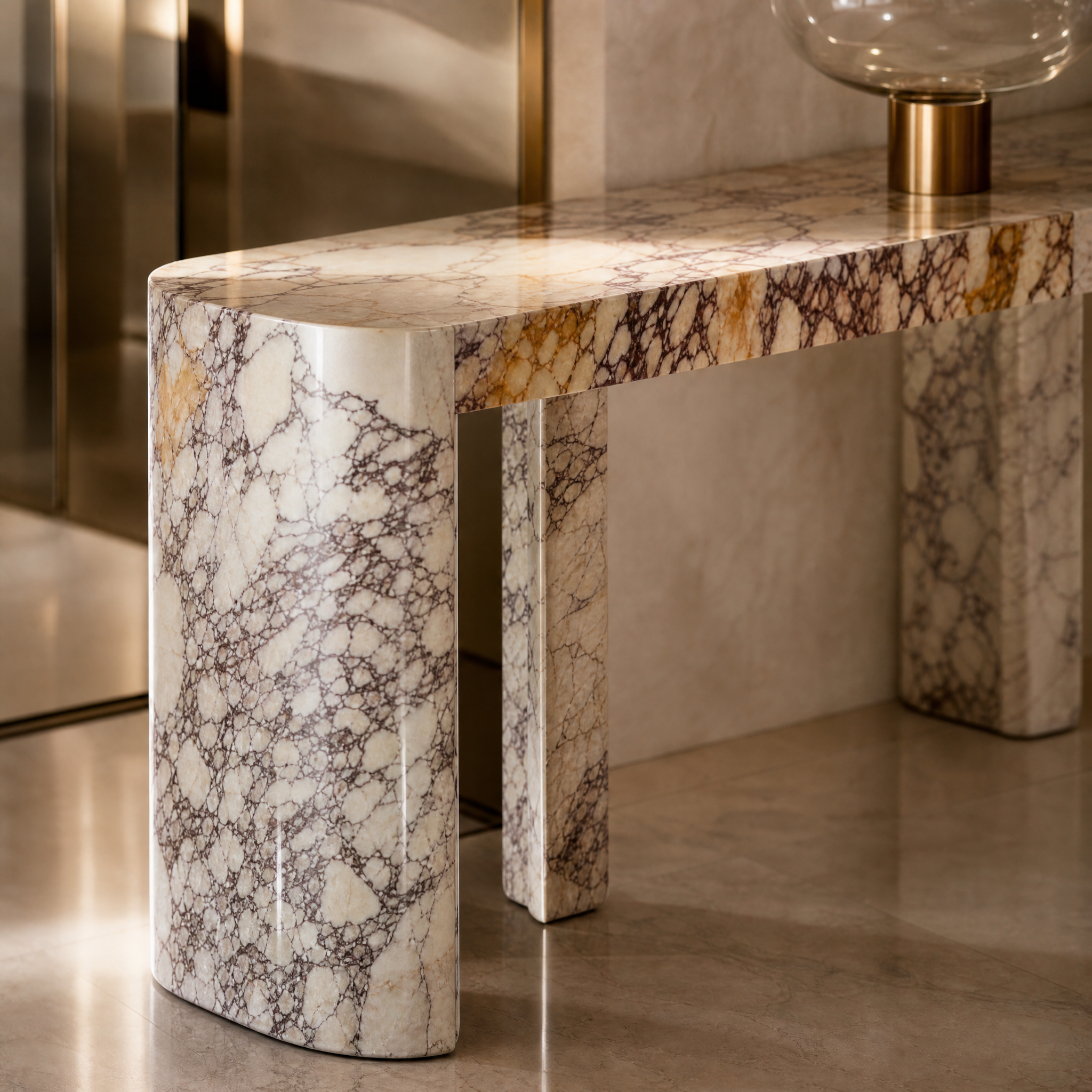 Close-up detail of the VORELLI Rivolino console table showcasing the natural veining and elegant matt finish of the honed Viola marble.