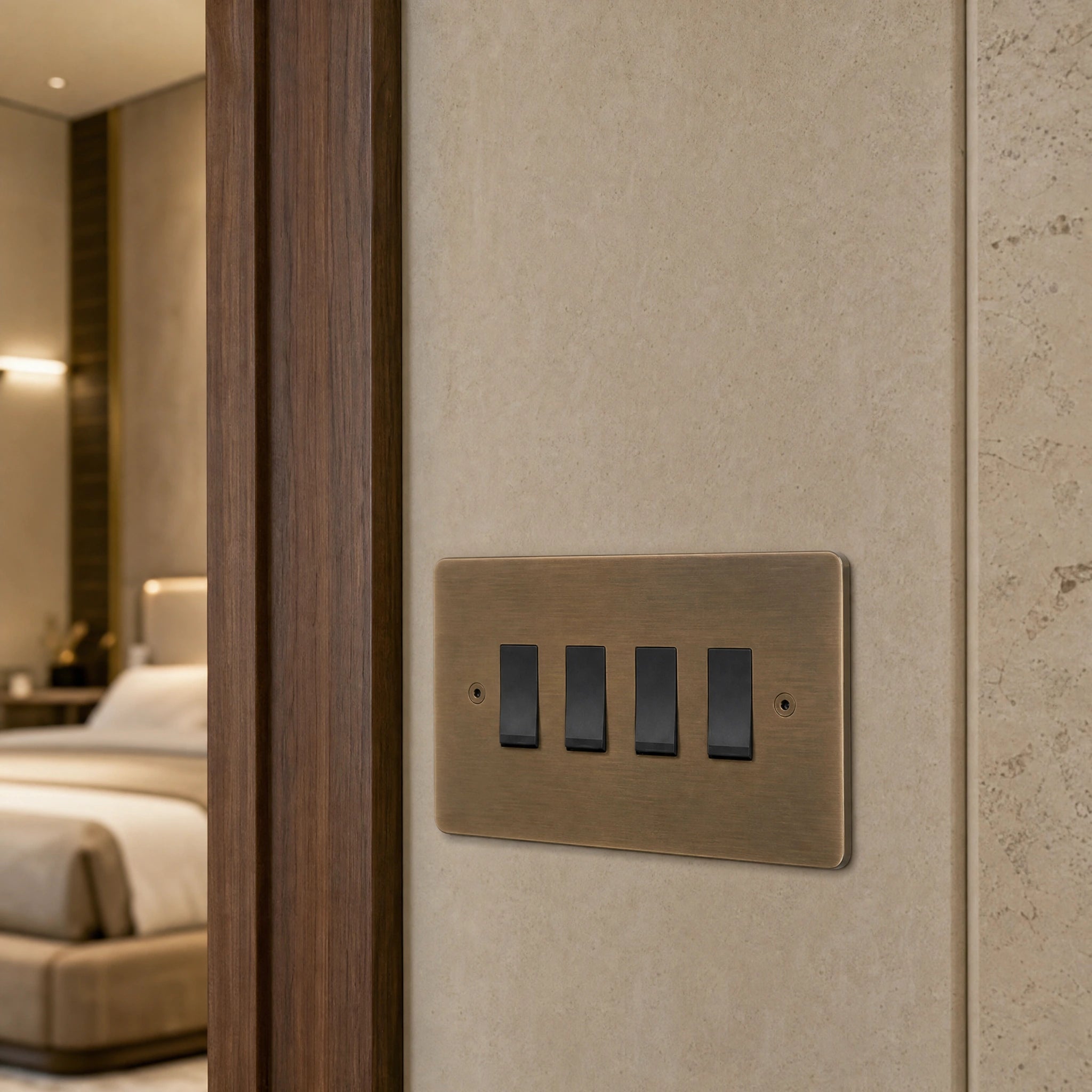 Close-up of a luxury antique brass rocker switch installed within feature wall beside an elegant doorway with refined timber panelling by VORELLI®.
