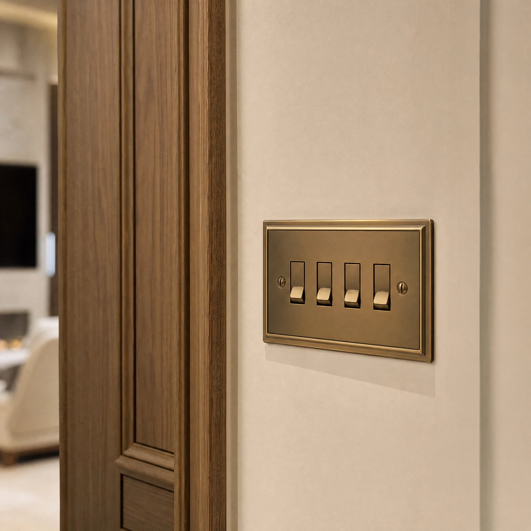 Close-up of a luxury antique brass rocker switch installed within feature wall beside an elegant doorway with refined timber panelling by VORELLI®.